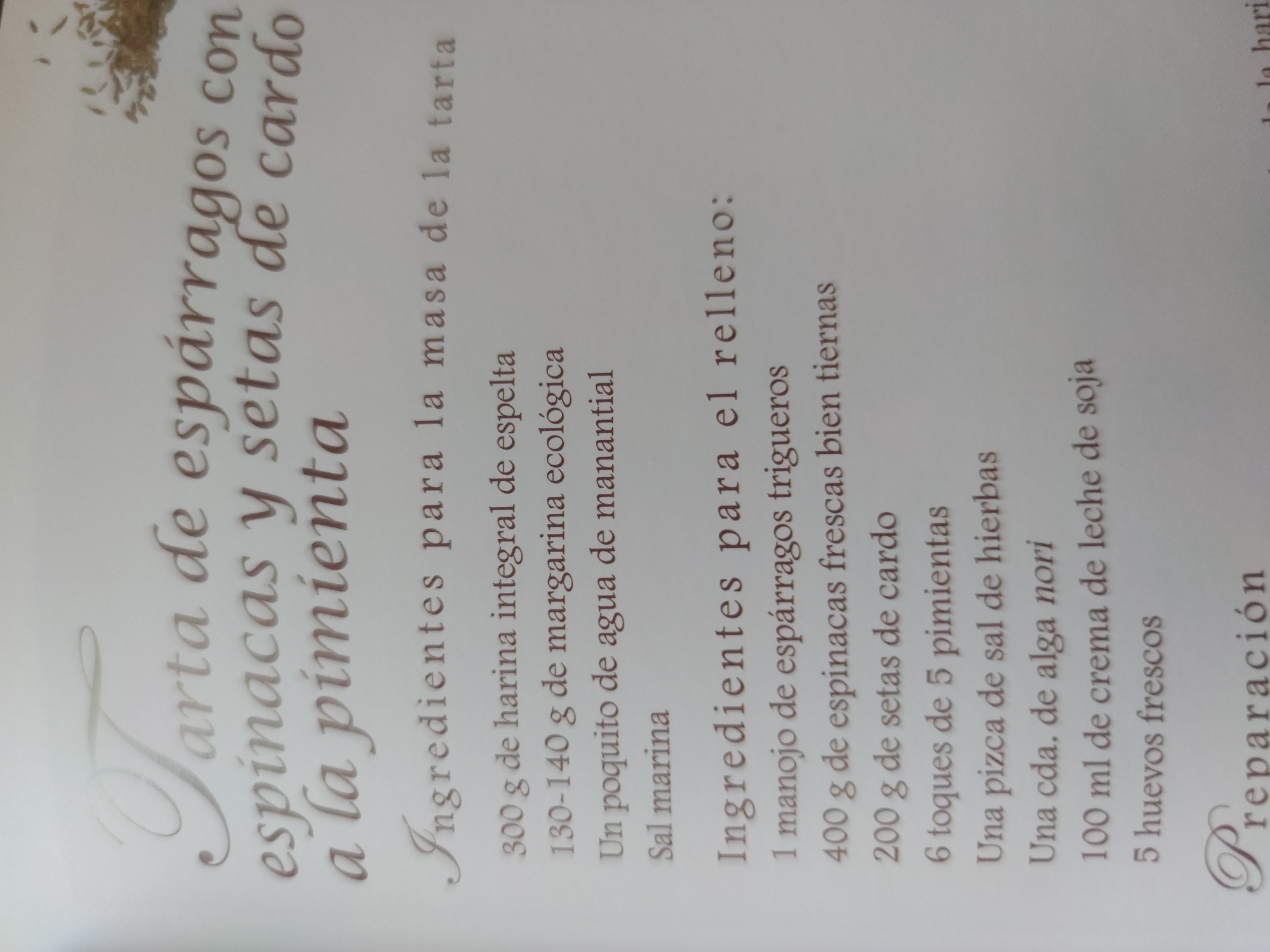 The image shows a recipe in Spanish for a tart with asparagus, spinach, and thistle mushrooms with pepper. The image lists the ingredients for both the dough and the filling of the tart. The ingredients are written in a decorative font on a light background.