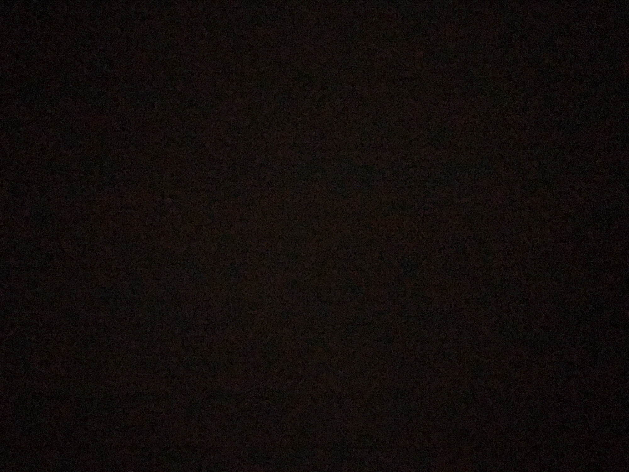 The image is a dark, grainy, and poorly lit photograph. It is difficult to discern any specific details about the subject, objects, or environment. There is no visible evidence to indicate that the image was taken in Yerevan, Armenia, or any other specific location.