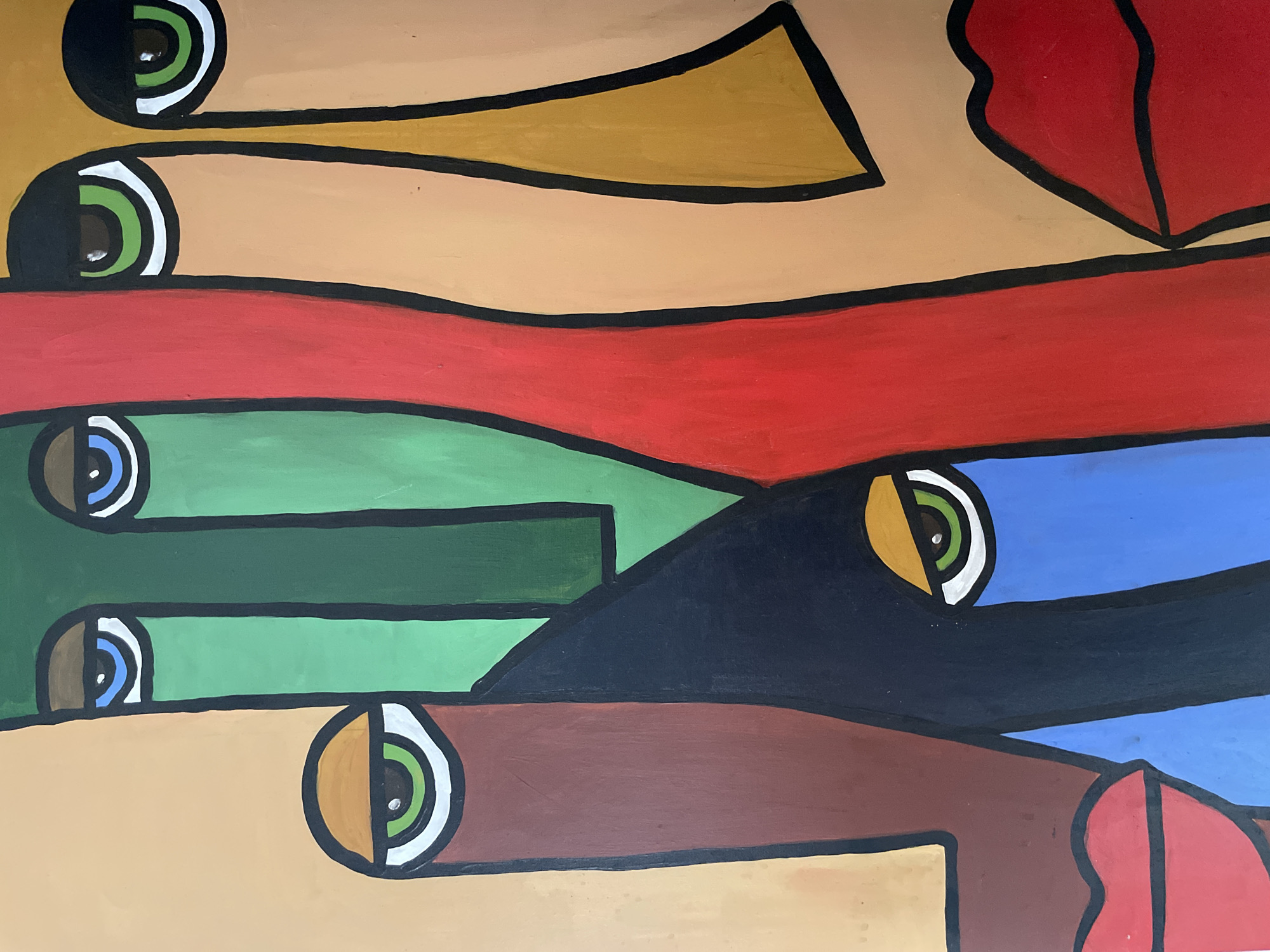 The image is a close-up, vertical shot of a colorful, abstract painting featuring multiple stylized faces. The faces are rendered with bold black outlines and flat blocks of color. There are at least five distinct faces visible, overlapping and intermingled.
The color palette includes skin tones of beige, tan, and a reddish-brown. Other prominent colors are green, red, blue, black, and yellow. The eyes of the faces are depicted with black pupils, green or blue irises, and white and black scleras, often outlined in black. The mouths are represented by bright red, full lips.
The composition is dynamic, with sharp angles and curved lines. The painting appears to be on a flat surface, possibly a canvas or wall, with no background elements visible beyond the artwork itself.
There is no indication of a specific location in the city of Ado, Nigeria, within the image. The image solely depicts the artwork.
