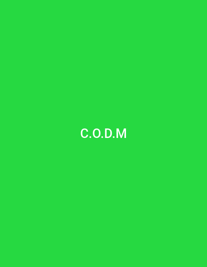 The image displays the text "C.O.D.M." in white, sans-serif font centered on a vibrant green background. There are no other discernible elements in the image. The provided information about the image being located in Serti, Nigeria is not visually supported by the image content.