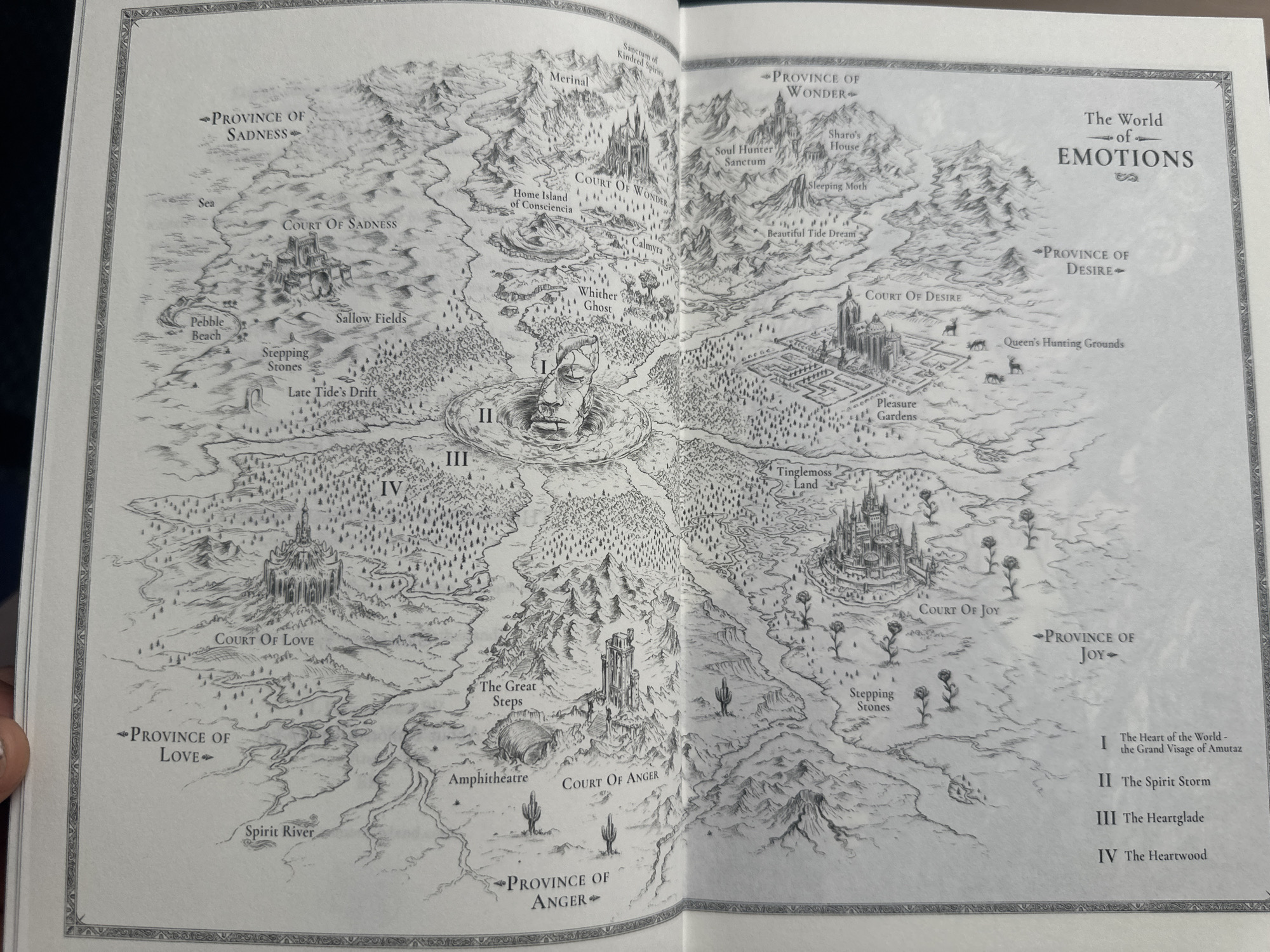 This is a monochrome map titled "The World of Emotions." It depicts various provinces and locations associated with different emotions, such as Sadness, Wonder, Desire, Love, Anger, and Joy. Each province contains distinct landmarks and features; for example, the Province of Sadness includes the Court of Sadness, a Pebble Beach, and Sallow Fields, while the Province of Wonder has the Court of Wonder, Soul Hunter Sanctum, and Sharo's House. Central to the map is "The Heart of the World - the Grand Visage of Amutaz," along with other areas labelled "The Spirit Storm," "The Heartglade," and "The Heartwood." The level of detail suggests a fictional world-building exercise or a fantasy narrative's map. There is no information about the city of Nivelles in Belgium or any location related to it in the image.