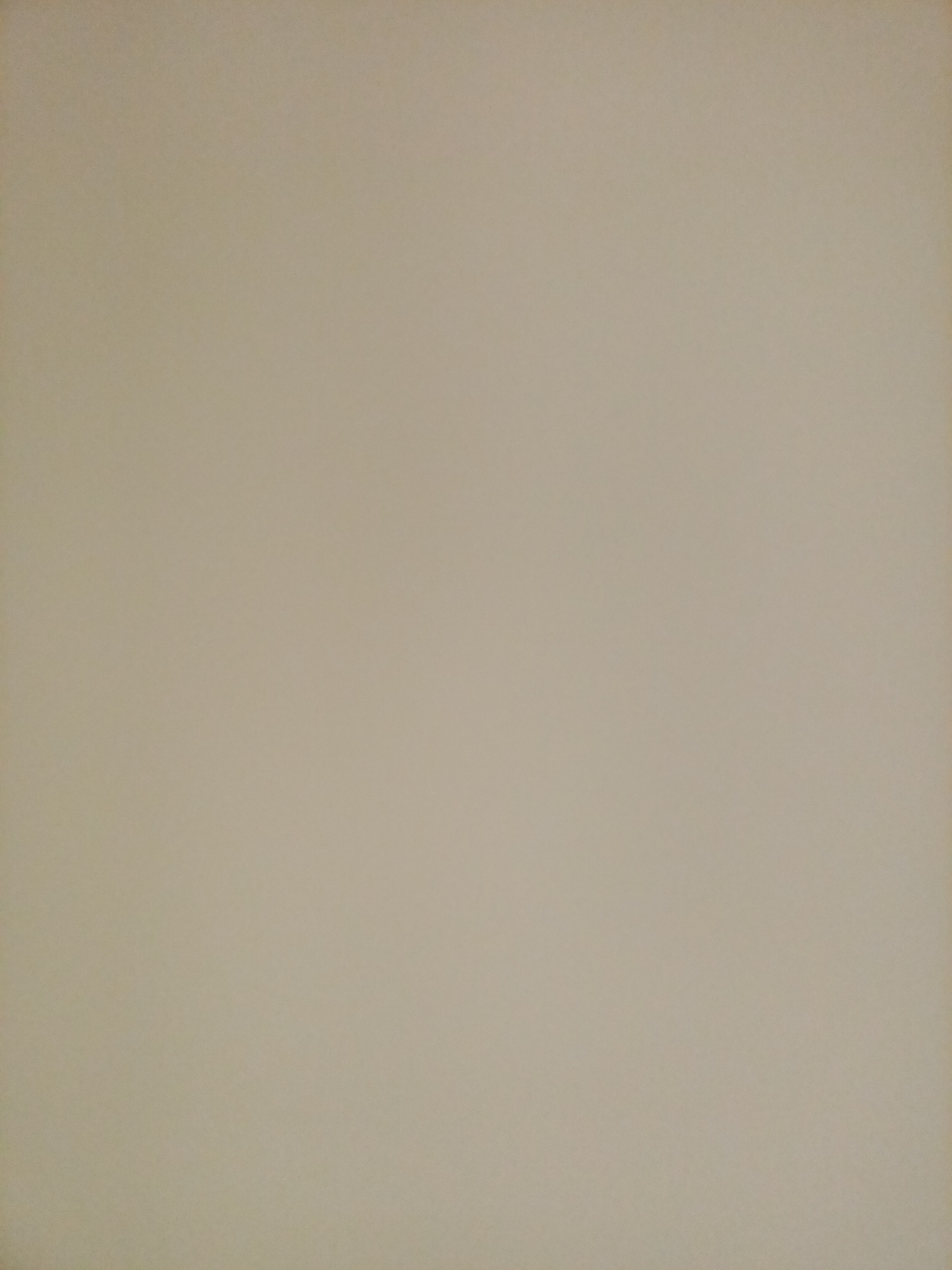 The image is a plain, unadorned, light brown textured surface, likely a wall. There are no objects, people, or discernible features present in the image. The lighting appears even, with no strong shadows or highlights. The texture suggests a slightly rough finish, possibly painted or wallpapered. No specific location in Rostov-on-Don, Russia, can be identified from this image.