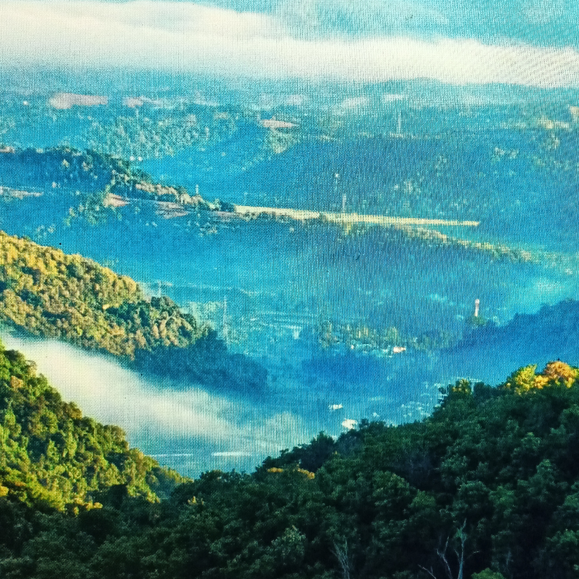 The image depicts a mountainous landscape with lush green vegetation and rolling hills, likely a natural reserve or a scenic viewpoint. The presence of mist or fog in the valleys adds to the atmospheric effect, suggesting a humid or mountainous climate. The scattered structures visible in the distance hint at human settlement, possibly a village or small town nestled within the natural terrain. The sky appears clear with some wispy clouds, indicating fair weather.

Without further information or distinctive landmarks, it is impossible to definitively pinpoint the location within Ende, Indonesia. However, the characteristics of the landscape are consistent with the topography found in and around the mountainous regions of Ende, which is known for its natural beauty and volcanic formations. Ende is situated on the southern coast of Flores Island, which is characterized by its varied terrain, including mountains, hills, and coastal areas. Therefore, this image could potentially represent a view from a vantage point in the hills overlooking the town and its surroundings.