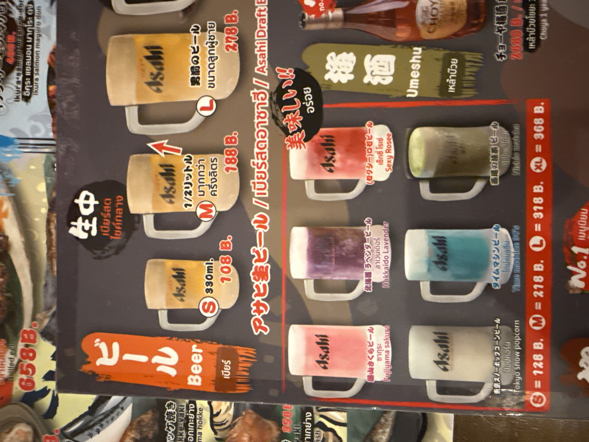 The image shows a page from a Thai-language menu advertising Asahi beer, apparently from Bangkok, Thailand. The beers are displayed in mug-like shapes and various flavors and sizes are listed, along with their prices in Thai Baht. The menu also includes items like grilled eel, Ikura salmon magure don, and grilled hokke. Other drinks, such as Umeshu and Choya plum wine, are also listed.