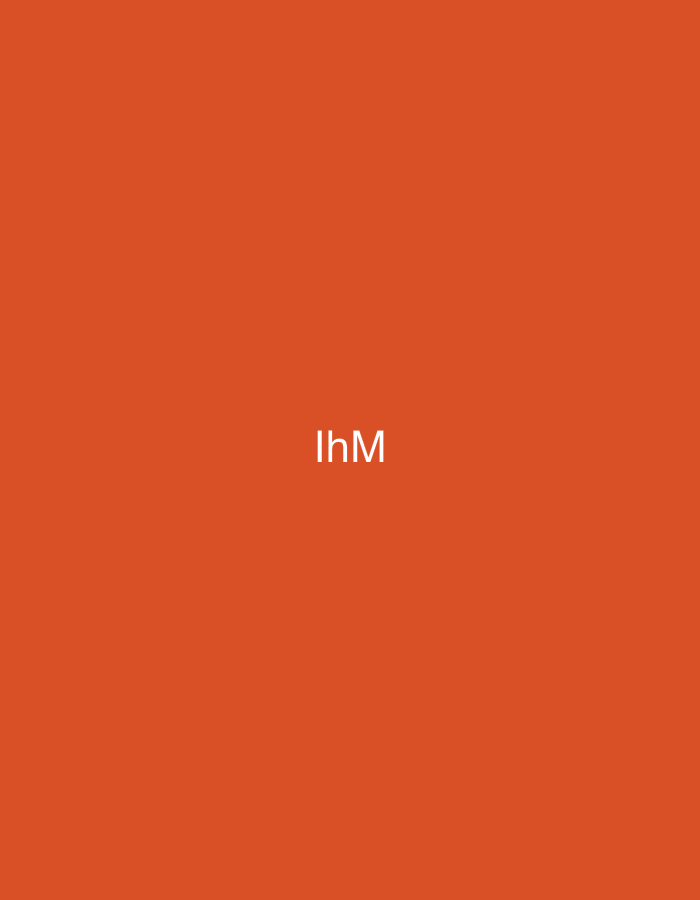 The image displays a solid, uniform orange background. Centered within this field are the capital letters 'IhM' rendered in white, sans-serif typography. The text is sharply defined against the monochromatic background, occupying the central portion of the frame. No other visual elements, subjects, objects, or discernible actions are present. The scene, for which this image serves as a representation, is located in the city of Casablanca, Morocco.