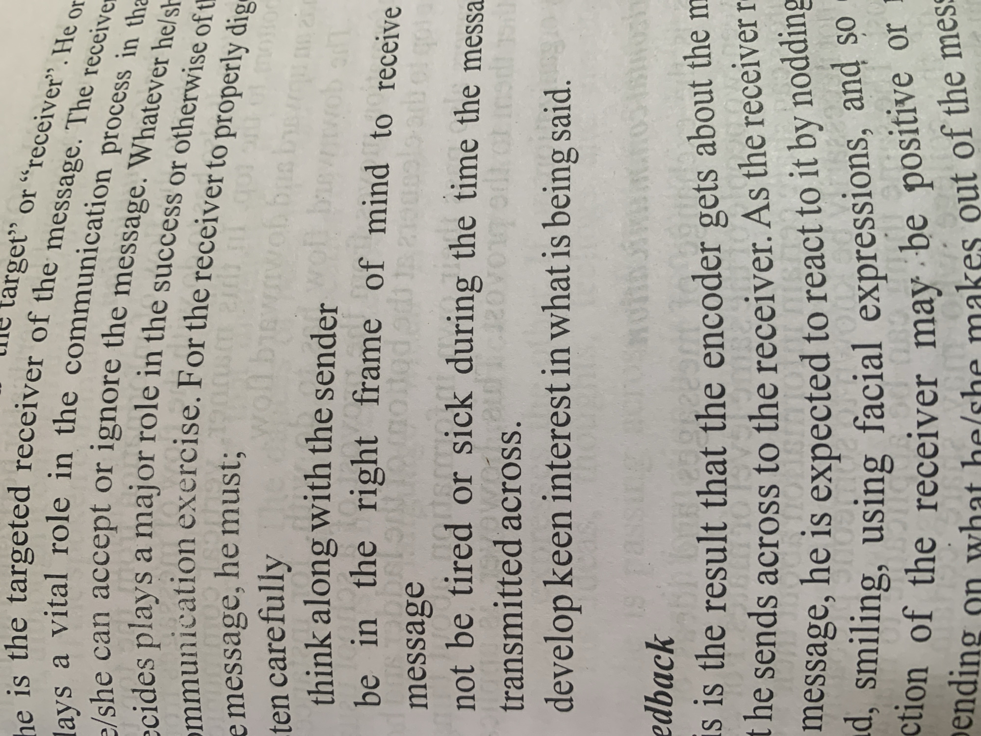 The image shows a close-up of a page from a book, with text printed in black ink on white paper. The text discusses communication and the roles of the sender and receiver. There are no people, objects, or environmental elements visible beyond the text itself and the paper it is printed on. The location of Jauro Yinu, Nigeria is not depicted or mentioned in this image.
