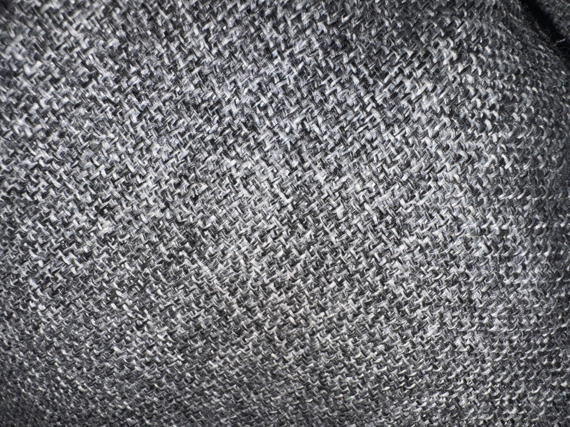 The image shows a close-up of gray and white woven fabric with a diagonal weave pattern. There is no information in the image about the location in Kuta Selatan, Indonesia.