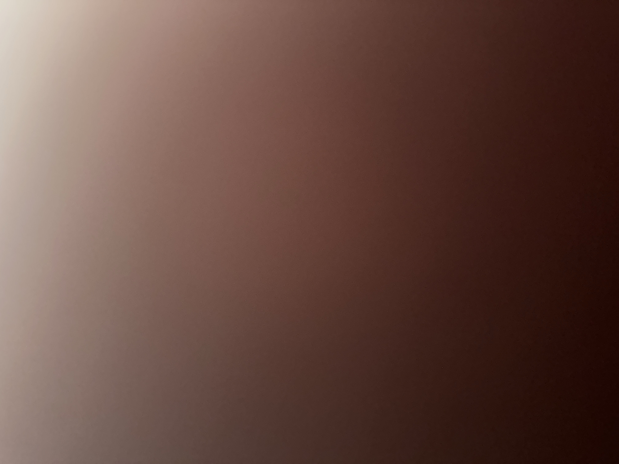 This media file is an abstract, abstract, or textured image with a gradient of colors. The colors range from a light, almost white shade on the left side of the image to a deep, dark brown on the right. The transition between these colors is smooth and gradual, creating a soft, blended effect. There are no discernible subjects, objects, scene, setting, activity, or event depicted in this image. No notable details such as time of day, weather, location cues, emotions, or visible text are present. The image appears to be a close-up of a textured surface or a digital creation with a color gradient.