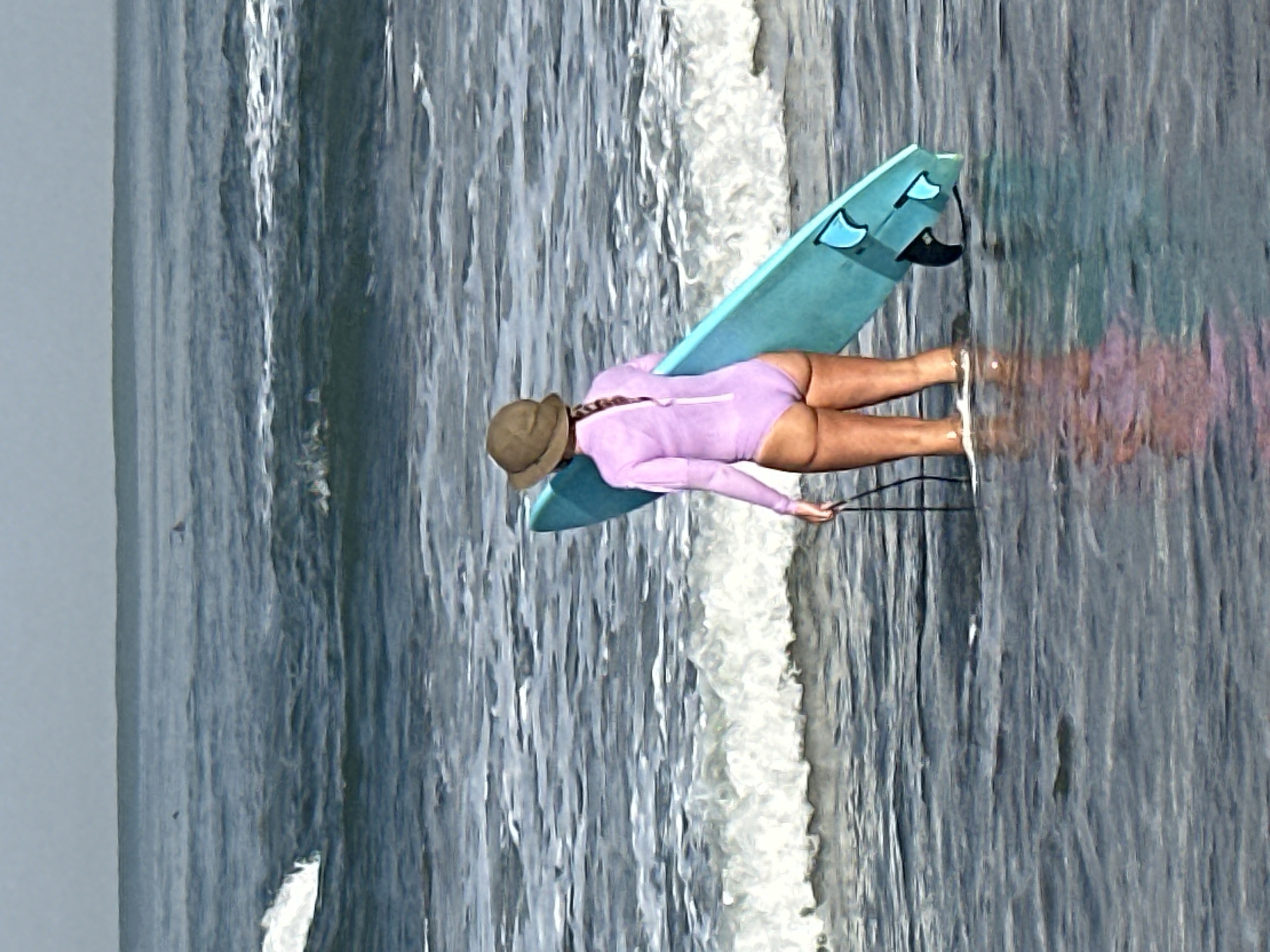 A person wearing a lavender swimsuit and a brown sun hat stands in shallow ocean water holding a teal surfboard. The surfboard has three fins at the bottom. The person's back is to the camera, and their hair is in a braid. The water is choppy with small waves breaking in the background. The sky is overcast. The location is the coast of North Kuta, Indonesia.