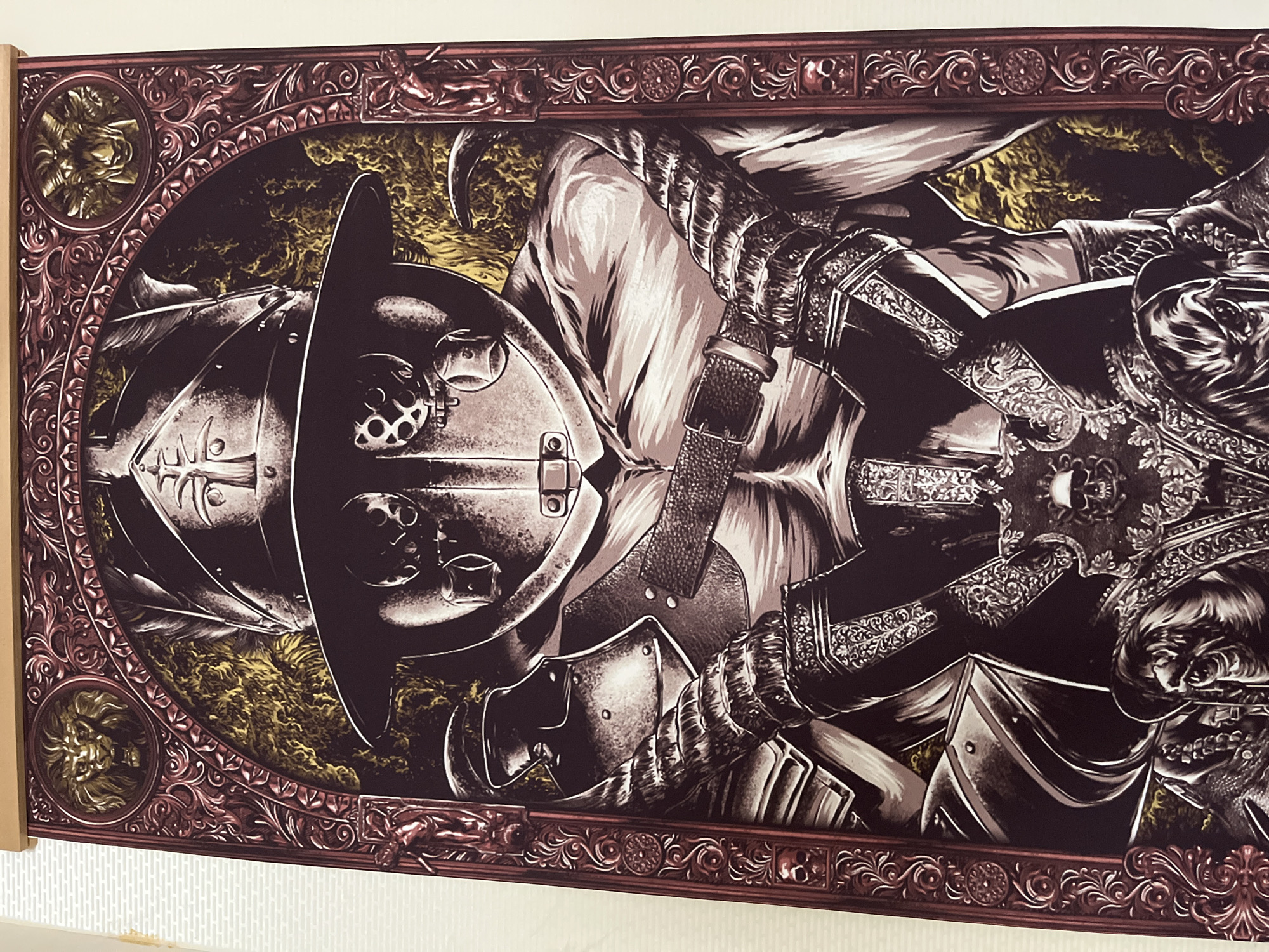 An ornate, highly detailed illustration depicts a heavily armored figure, possibly a warrior or knight, set within an elaborate decorative frame. The main subject is centered and shown from the waist up, facing forward. The figure wears a distinctive broad-brimmed helmet or hat with visible eye-slits and mouth opening, giving it a somewhat skull-like or stylized appearance. The body is encased in elaborate, segmented plate armor, rich with intricate etched patterns and designs. A buckled belt cinches the waist, and armored gauntlets are visible, one hand seemingly gripping the ornate hilt of a sword or dagger.
The background behind the figure is dark with splashes of golden-yellow, suggesting an ethereal, smoky, or turbulent atmosphere, possibly representing fire or magical energy. The entire illustration is contained within a richly detailed, dark red or maroon frame. This frame features intricate, swirling baroque or gothic-style patterns and includes circular medallions at what would be the top and bottom corners if the image were properly oriented. These medallions contain detailed golden reliefs of roaring lion heads or grotesque faces. Smaller relief sculptures, including one resembling a satyr or centaur, adorn the horizontal edges of the frame.
The art style is illustrative, with strong lines and dramatic shading that highlight the metallic sheen of the armor. No specific activity is depicted; the figure stands in a stoic and formidable pose. The time of day and specific location are not indicated beyond the abstract background. There is no visible text within the illustration or on the frame.