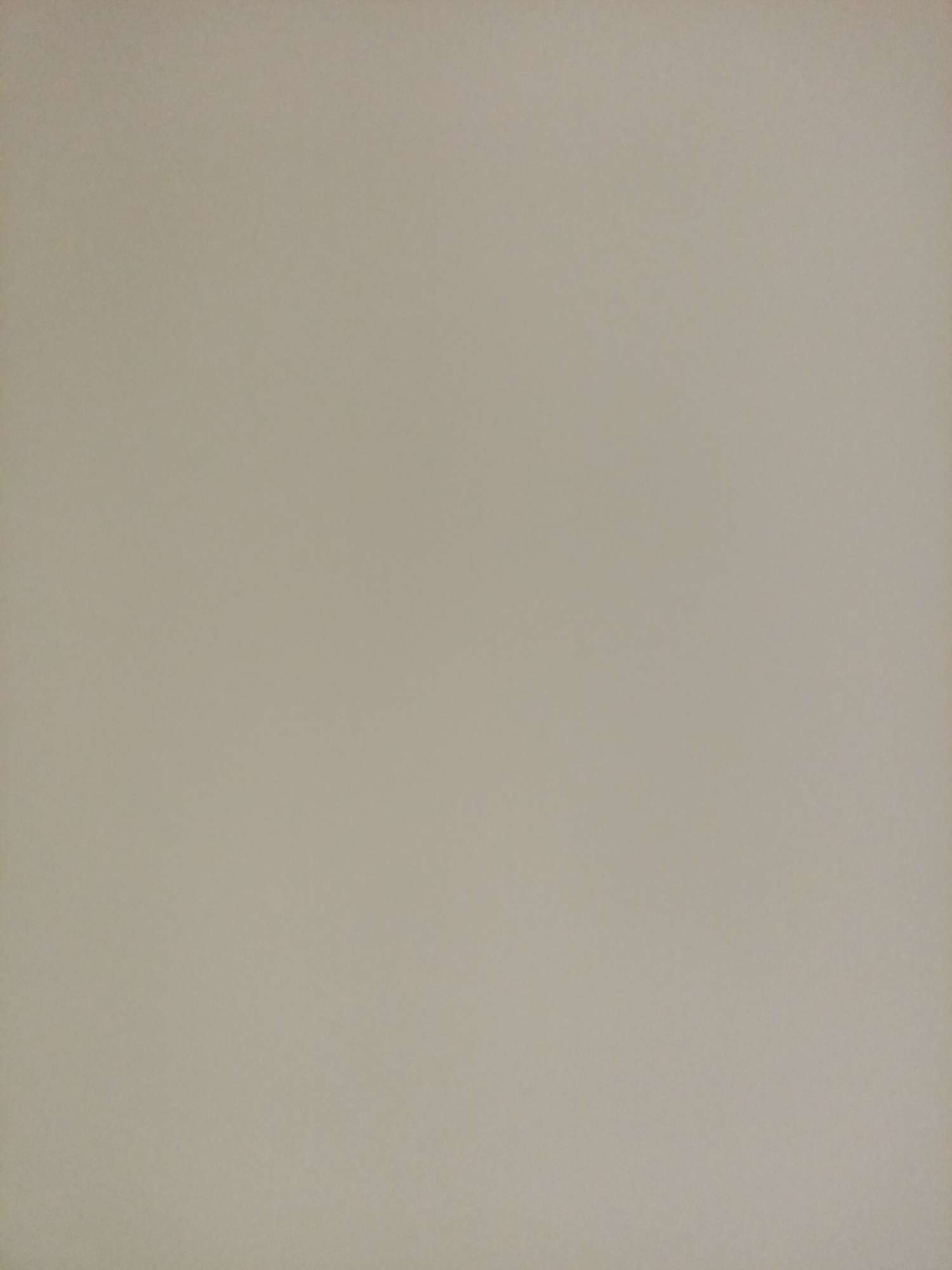 The image is a solid color background with a slightly textured, neutral tone, resembling a wall or a piece of paper. There are no discernible objects, people, or environmental features present in the image. The photograph provides no information about the city of Rostov-on-Don, Russia, or any specific location within it.