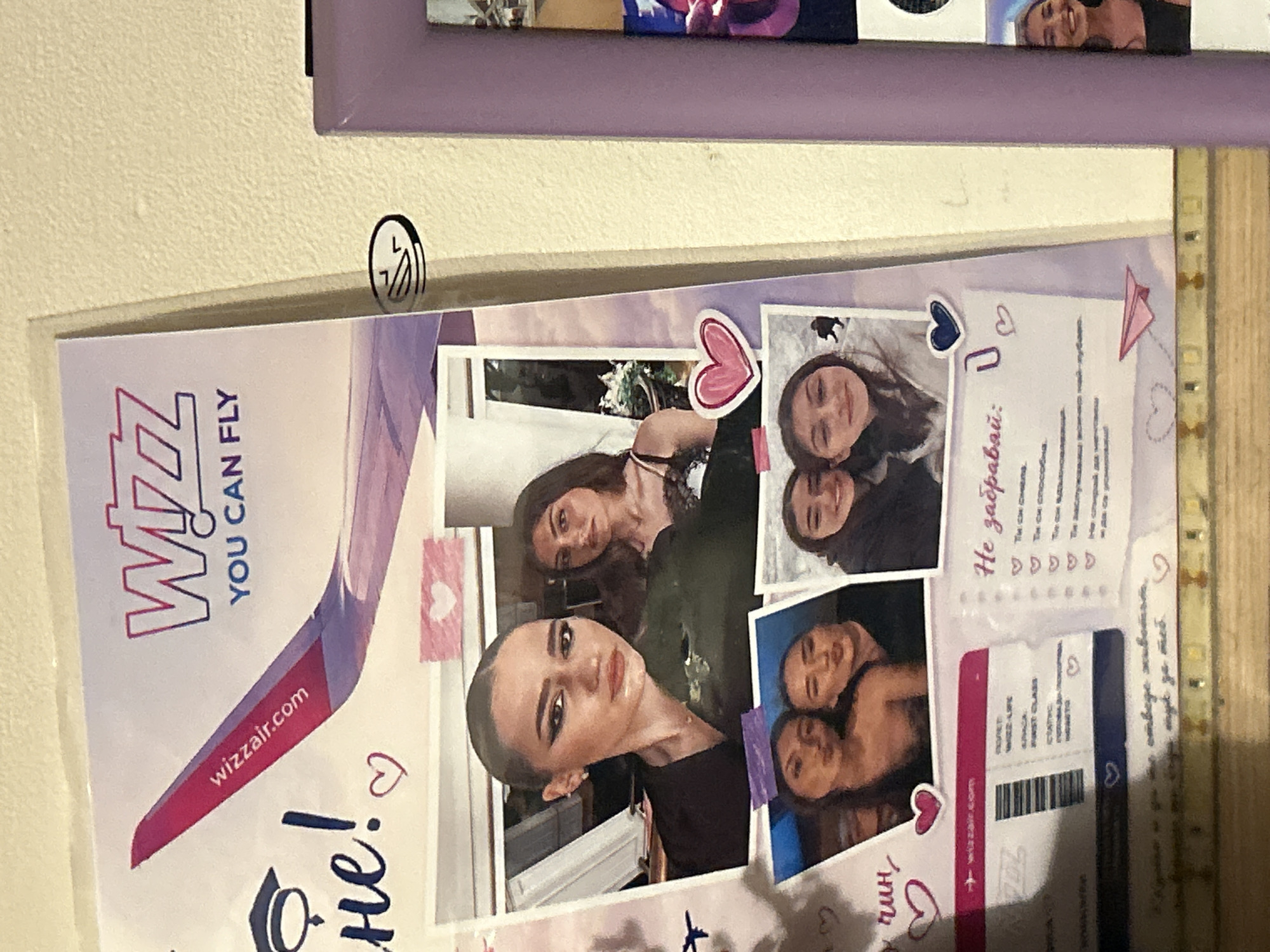 The image shows a collage featuring photos of a young woman. The collage includes a promotional image of Wizz Air with the tagline "YOU CAN FLY" and their website. There is also a section with Cyrillic text, potentially a message to the woman. A "ticket" element mimics a first-class boarding pass for Wizz Air with "Burgas" visible, indicating the woman might be from Burgas, Bulgaria. There are heart and graduation cap motifs scattered throughout the collage. The overall environment suggests the collage is a personal memento or a gift.