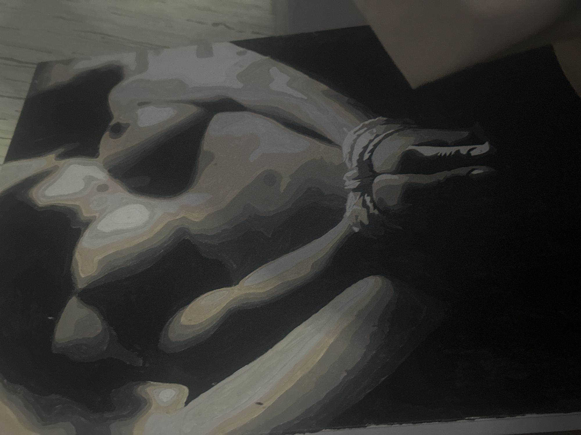 The image depicts a grayscale painting of a person, possibly a woman, with their hands bound. The setting or location in Высокий, Russia, is not discernible from the painting itself.