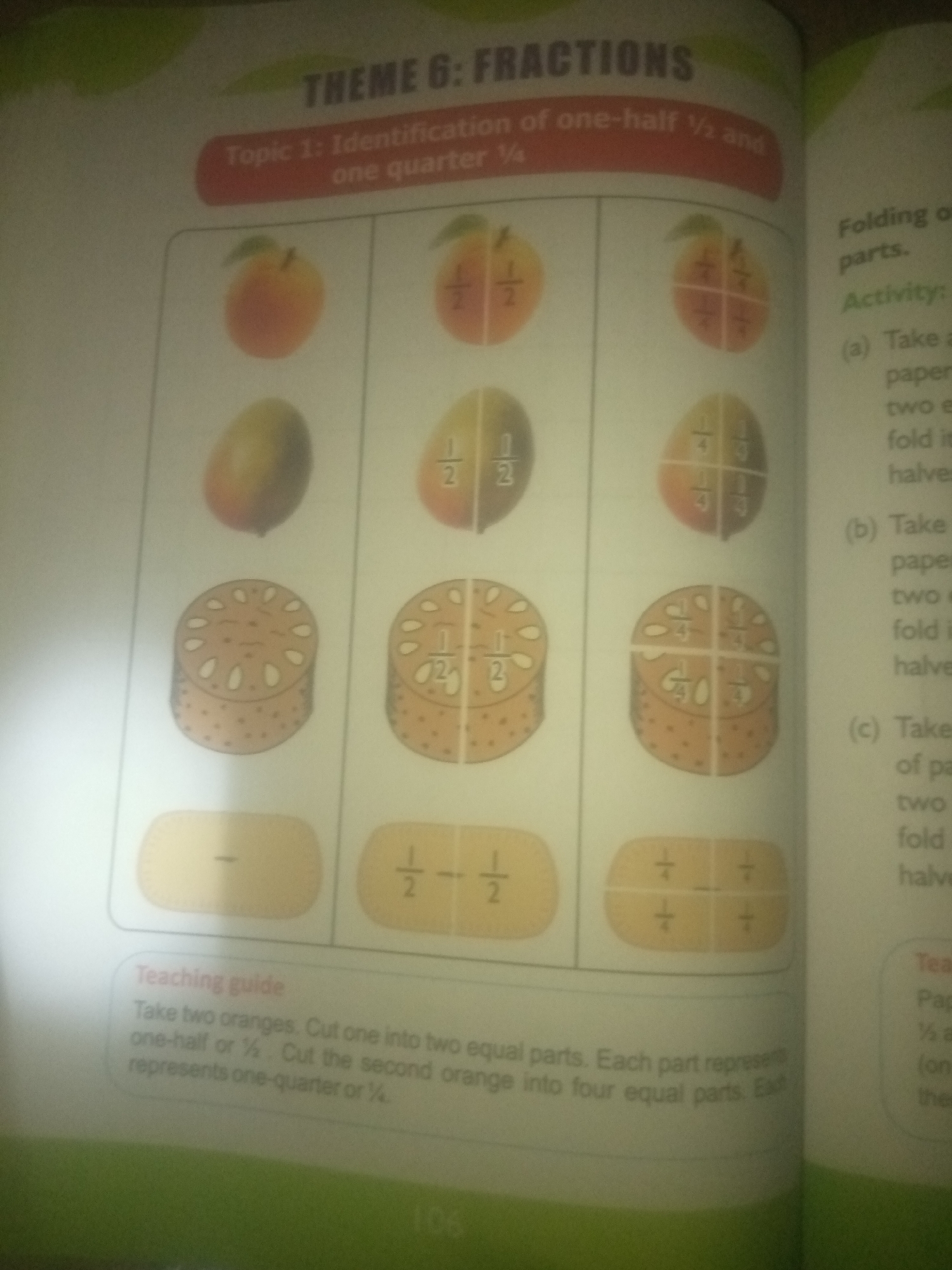 The image shows a page from a children's educational book about fractions. The page is divided into sections, with the main part featuring illustrations of fruits and food items divided into halves and quarters, along with their corresponding fractional representations. The topic "THEME 6: FRACTIONS" and "Topic 1: Identification of one-half ½ and one quarter ¼" are displayed prominently at the top. A "Teaching guide" section at the bottom explains an activity involving oranges to demonstrate halves and quarters. To the right, there are instructions for an activity titled "Folding on paper." The background is a plain white surface, suggesting a tabletop or desk. There is no information or visual evidence within the image that relates to the city of Jauro Yinu, Nigeria.
