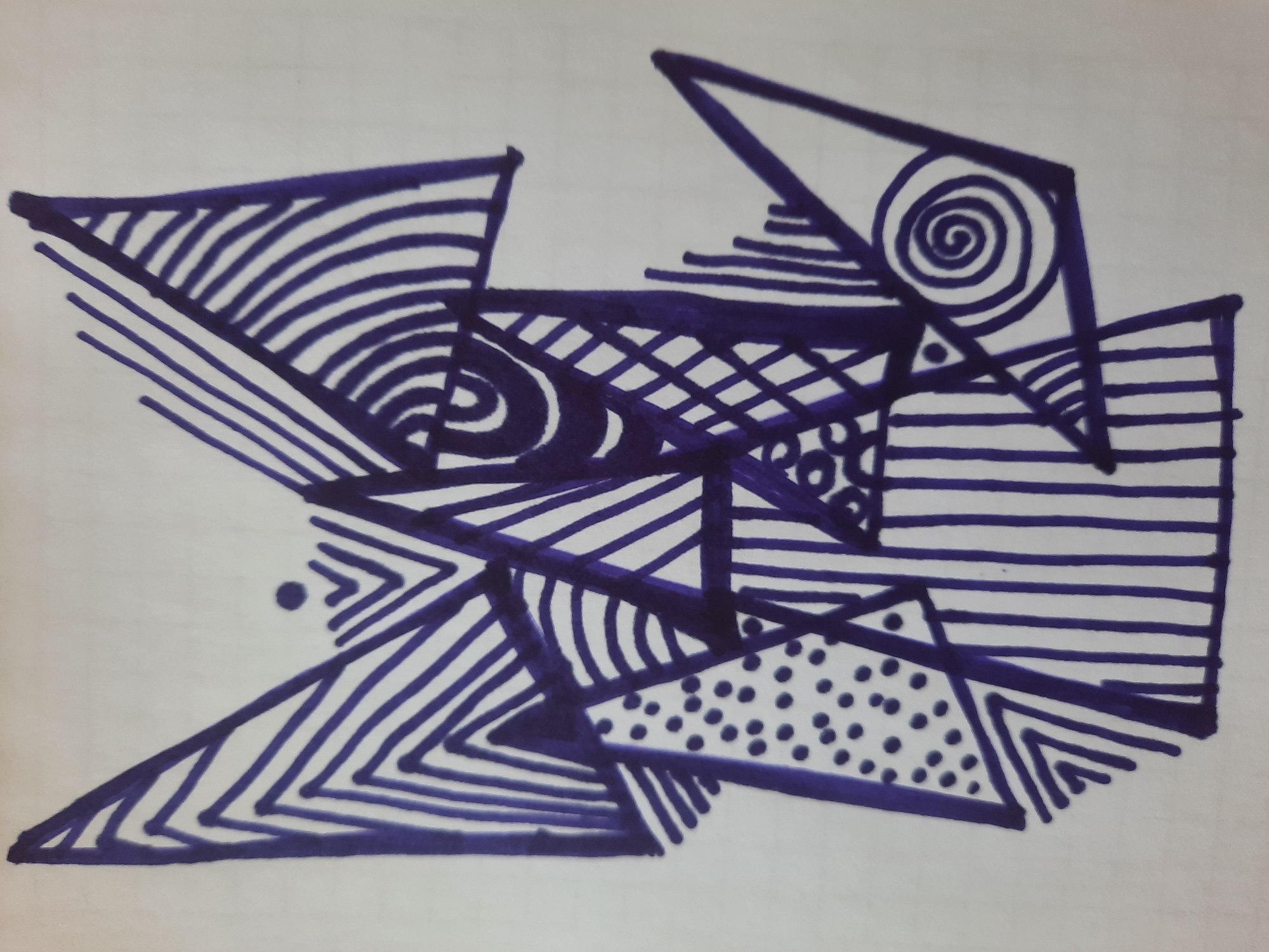 The image is a close-up, full-frame shot of an abstract drawing made with a dark blue marker on white paper. The drawing consists of a complex arrangement of geometric shapes, primarily triangles and polygons, filled with various patterns. These patterns include parallel lines at different angles, concentric curves, a grid-like crosshatching, a stippled dot pattern, and a spiral. The composition is dynamic and layered, with shapes overlapping and intersecting. The overall impression is one of intricate detail and deliberate design. The location of this drawing within the city of Simferopol, Ukraine, cannot be determined from the image itself, as it is a close-up of artwork and provides no environmental context.