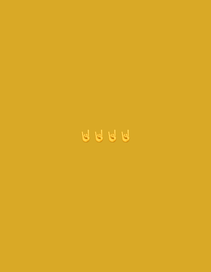 The image features a plain, mustard-yellow background. In the center of the image, three yellow emojis of hands making the "rock on" gesture are visible. The emojis are positioned horizontally and evenly spaced. There is no discernible location in Nowa Sól, Poland depicted in this image; it appears to be a digital creation or a digitally manipulated image.