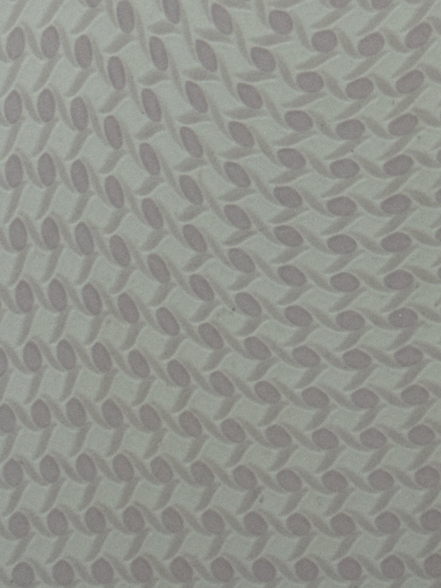 The image displays a repeating pattern of oval shapes with intertwining lines against a pale background. The pattern appears to be a texture or design on a surface, possibly wallpaper or fabric. There are no discernible people, objects, actions, interactions, or environmental features that would indicate a specific location within دهستان کسماء, Iran. The image is a close-up, abstract view of the pattern itself, lacking any contextual clues for geographic placement.