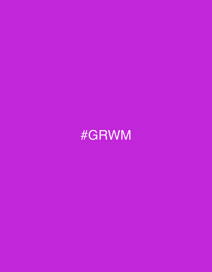 The image is a solid vibrant purple background with the white text "#GRWM" centered horizontally and slightly above the vertical center. There are no people, objects, or environmental elements visible in the image, nor is there any indication of a specific location, including Barcelona, Spain.