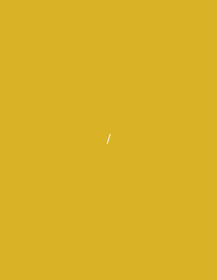 The image displays a solid, uniform mustard yellow background. A solitary, thin white line is positioned centrally within the frame, oriented diagonally from the upper left to the lower right. The line is short, measuring approximately one-tenth of the image's height. There are no identifiable individuals, objects, or environmental features present within this abstract composition. The scene, entirely graphic in nature, is located in the city of Santa Ana, Venezuela.