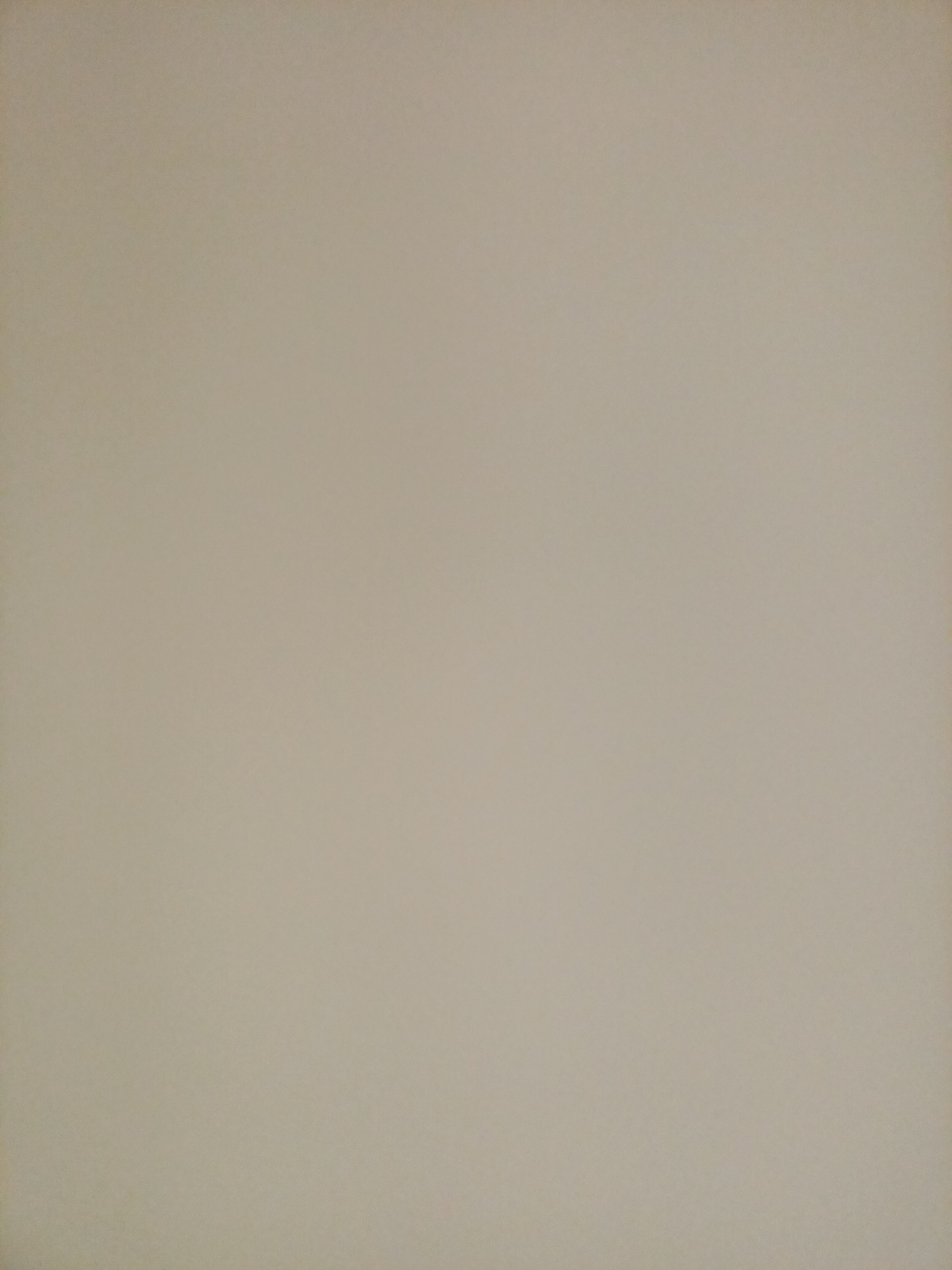 The image displays a plain, light beige surface, likely a wall or a large piece of paper. There are no discernible objects, people, or activities present. The lighting is even, with no strong shadows, suggesting an indoor environment or an overcast day. The texture appears smooth, with a slight grain visible upon close inspection. There is no indication of the specific location in Rostov-on-Don, Russia, or any other contextual information.