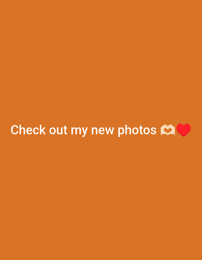 The image is a solid orange background with the text "Check out my new photos" followed by a hand making a heart emoji and a red heart emoji.
