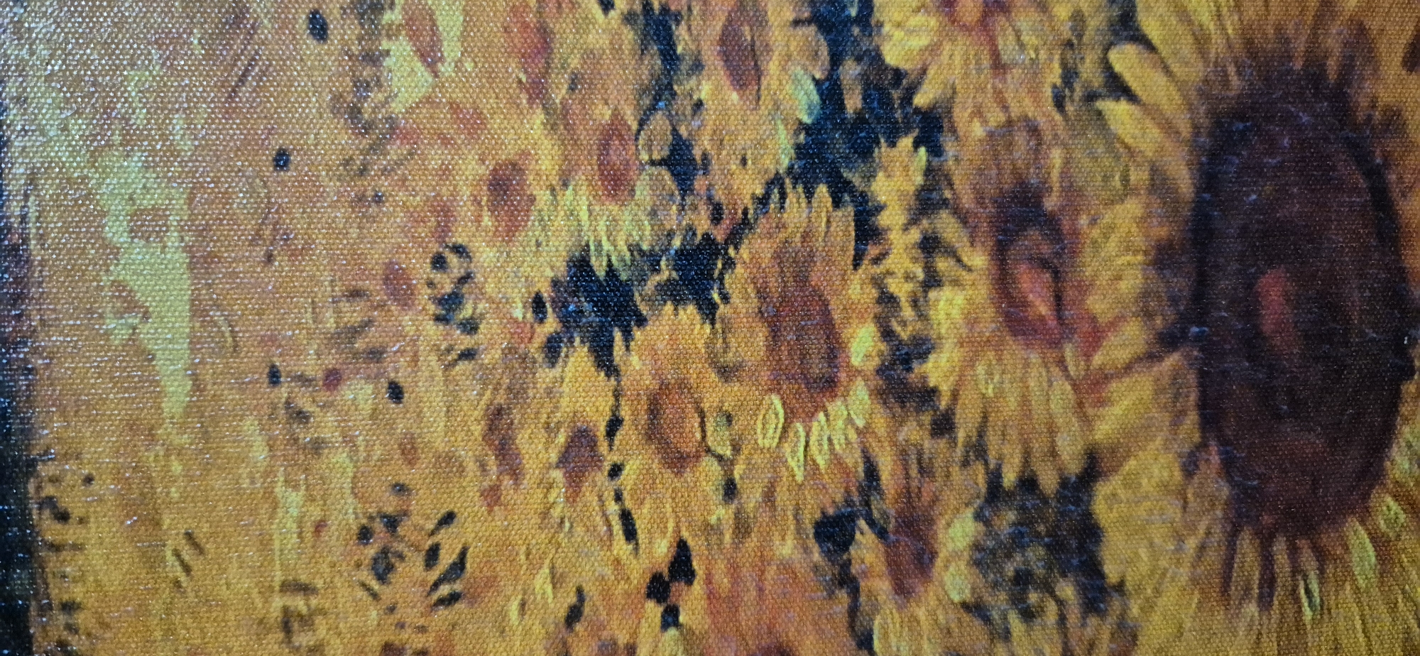 The image is a close-up, low-angle shot of a painting that appears to be of sunflowers. The painting is rendered in oil on canvas, with visible brushstrokes and the texture of the canvas showing through. The dominant colors are various shades of yellow, orange, and brown, with some areas of black. The arrangement of the sunflowers suggests a dense field or bouquet. No specific location in Navaluenga, Spain, can be determined from this image alone; it is a generic representation of a floral subject.