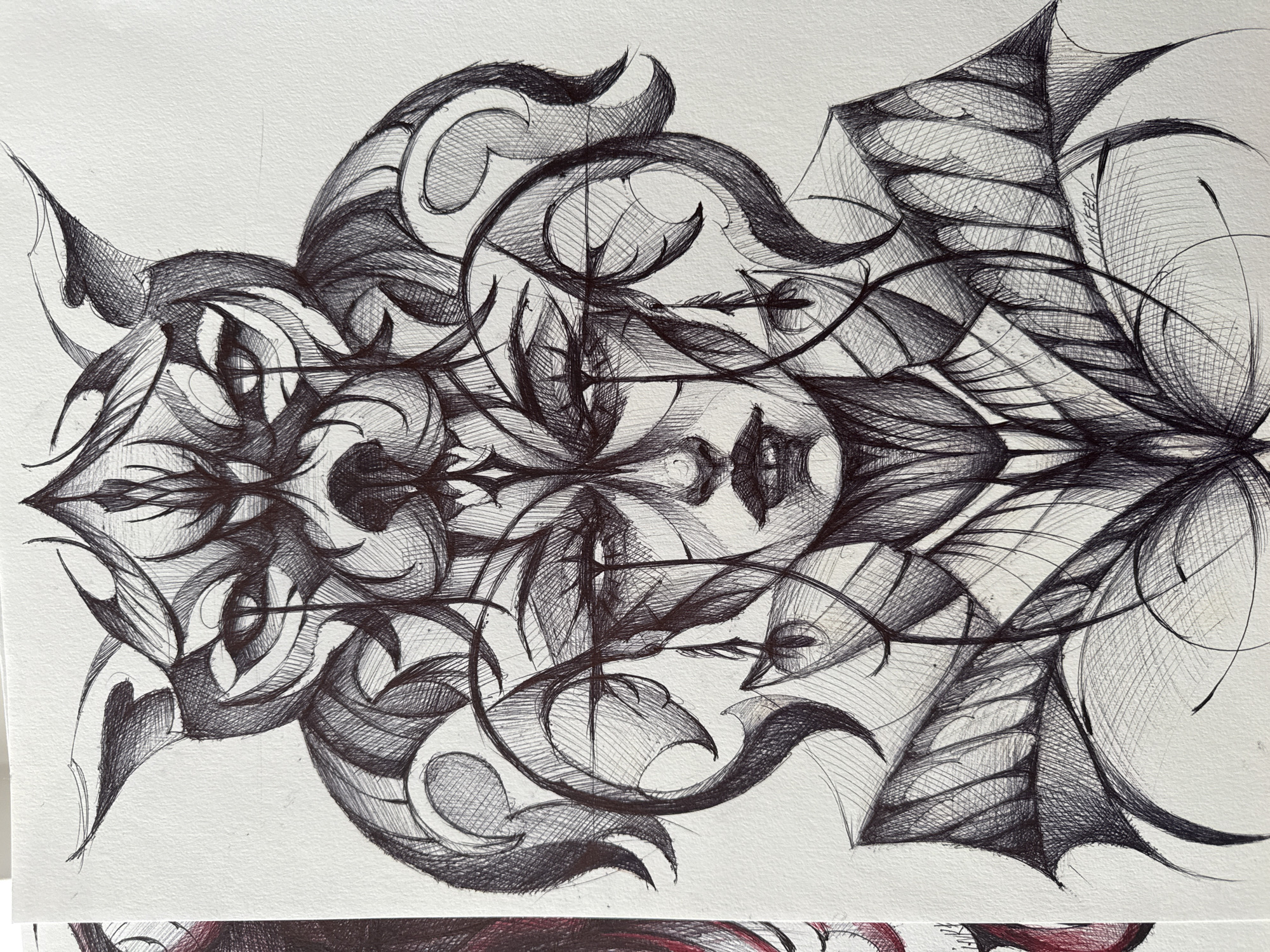 The image is a black and white abstract drawing on paper. The composition appears to be symmetrical, with mirrored elements on either side of a central axis. The drawing consists of complex, interwoven lines forming shapes that resemble leaves, swirls, and pointed forms. Shading is achieved through cross-hatching, creating tonal variations within the drawing. There are no people visible in the image. The drawing's style suggests a focus on intricate detail and balanced design.
There is no indication of the location being Sofia, Bulgaria.