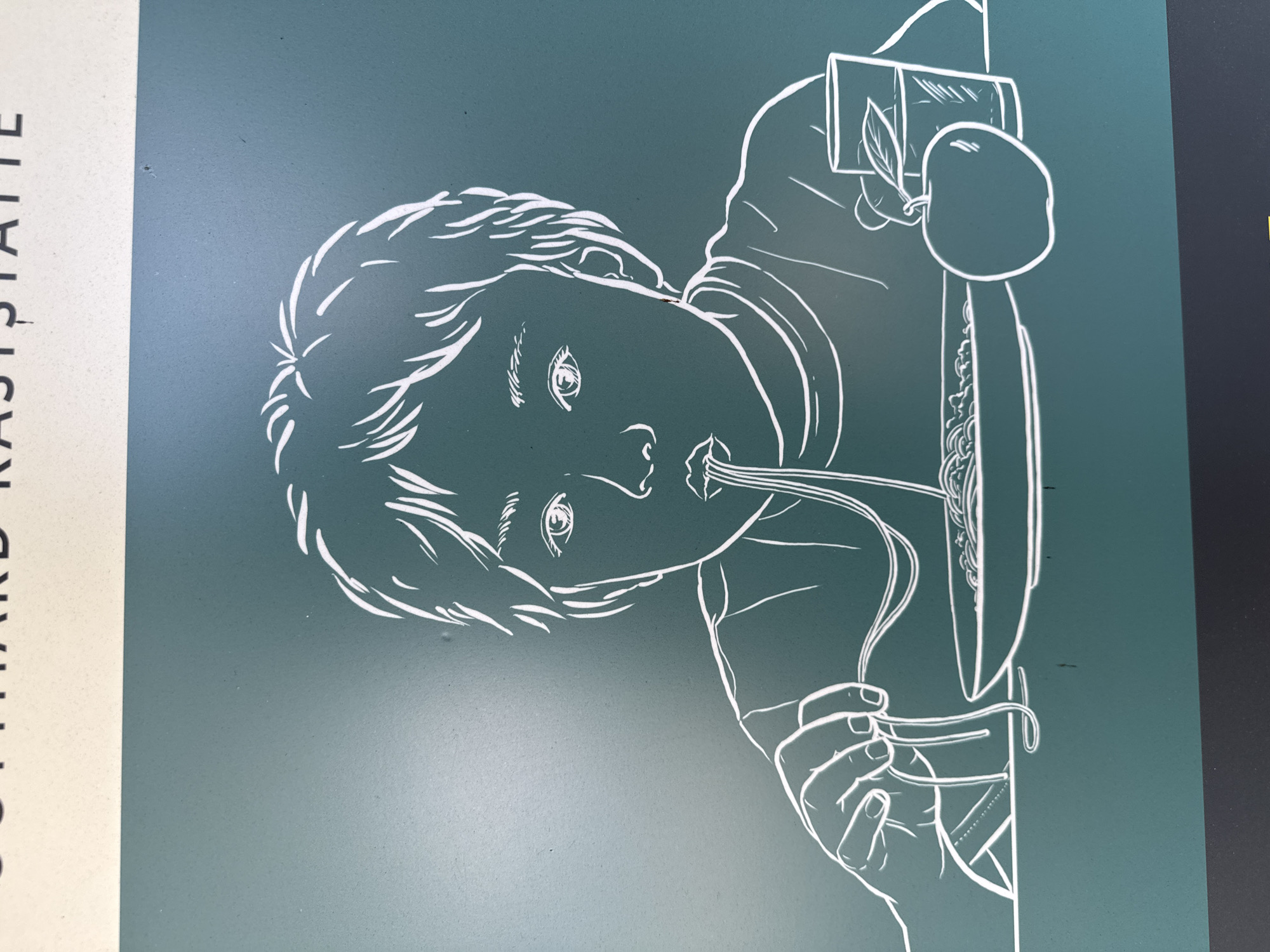 This is a photograph of a sign in Schattdorf, Switzerland, featuring a white line drawing of a child eating spaghetti. The child is depicted with their mouth open, slurping a strand of pasta from a fork. In front of the child is a bowl of spaghetti, an apple, and a glass of liquid. The background is a solid teal color. The words "GOTTHARD RASTSTÄTTE" are visible at the top of the sign, indicating it is located at a rest stop on the Gotthard Pass.