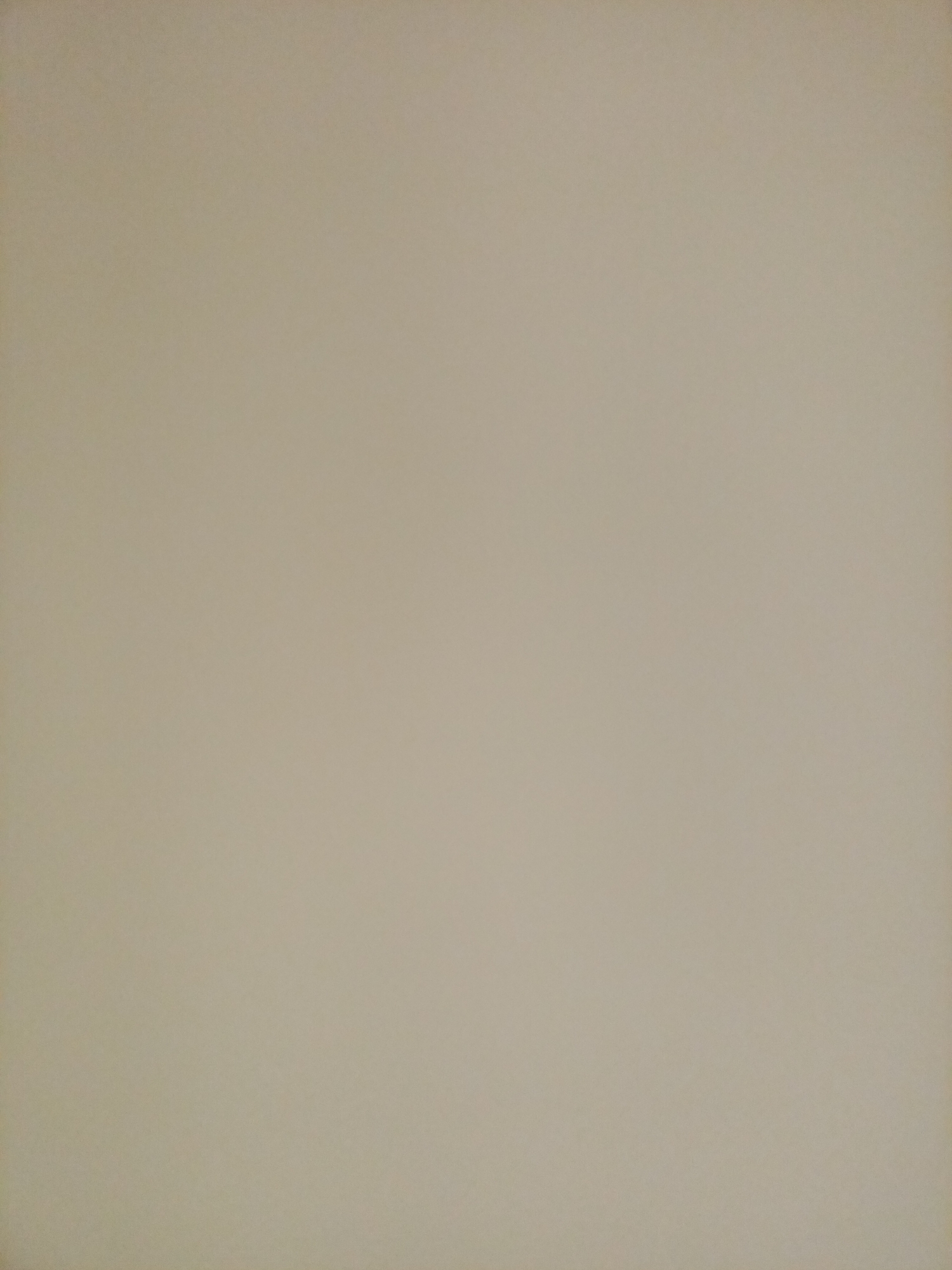 The image displays a plain, neutral-colored background, appearing to be a wall or a similar surface. There are no discernible objects, people, or actions visible in the image. The lighting is even, and the texture of the surface is slightly grainy. The scene is devoid of any specific environmental context, making it impossible to determine its location within Rostov-on-Don, Russia, or any other geographical area.
