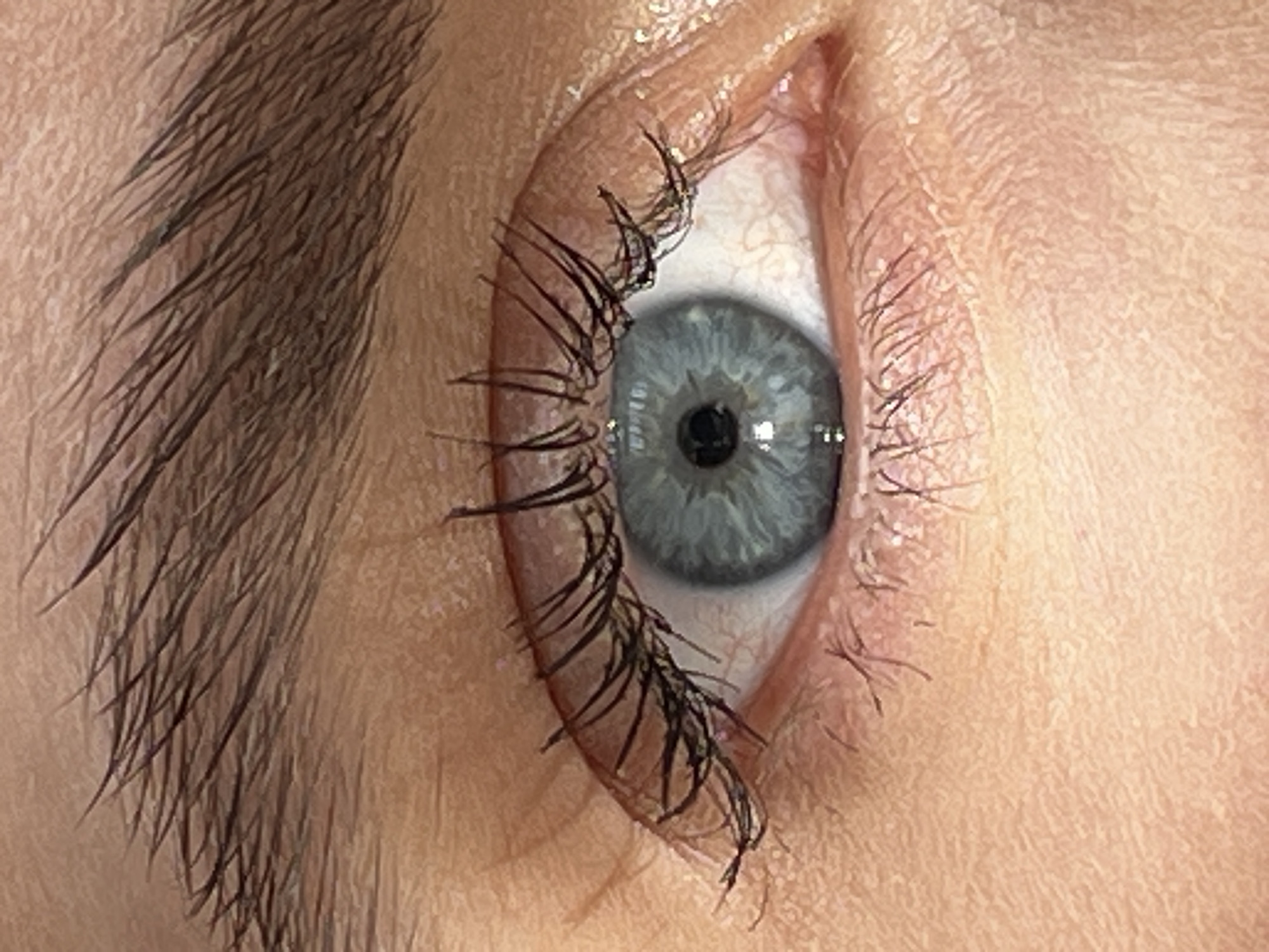 The image is a close-up of a human eye, viewed from the side. The eye has long, dark eyelashes and a gray iris. The skin around the eye is light-colored and shows some texture. There is no evidence of the location being in the city of Ternopil, Ukraine.