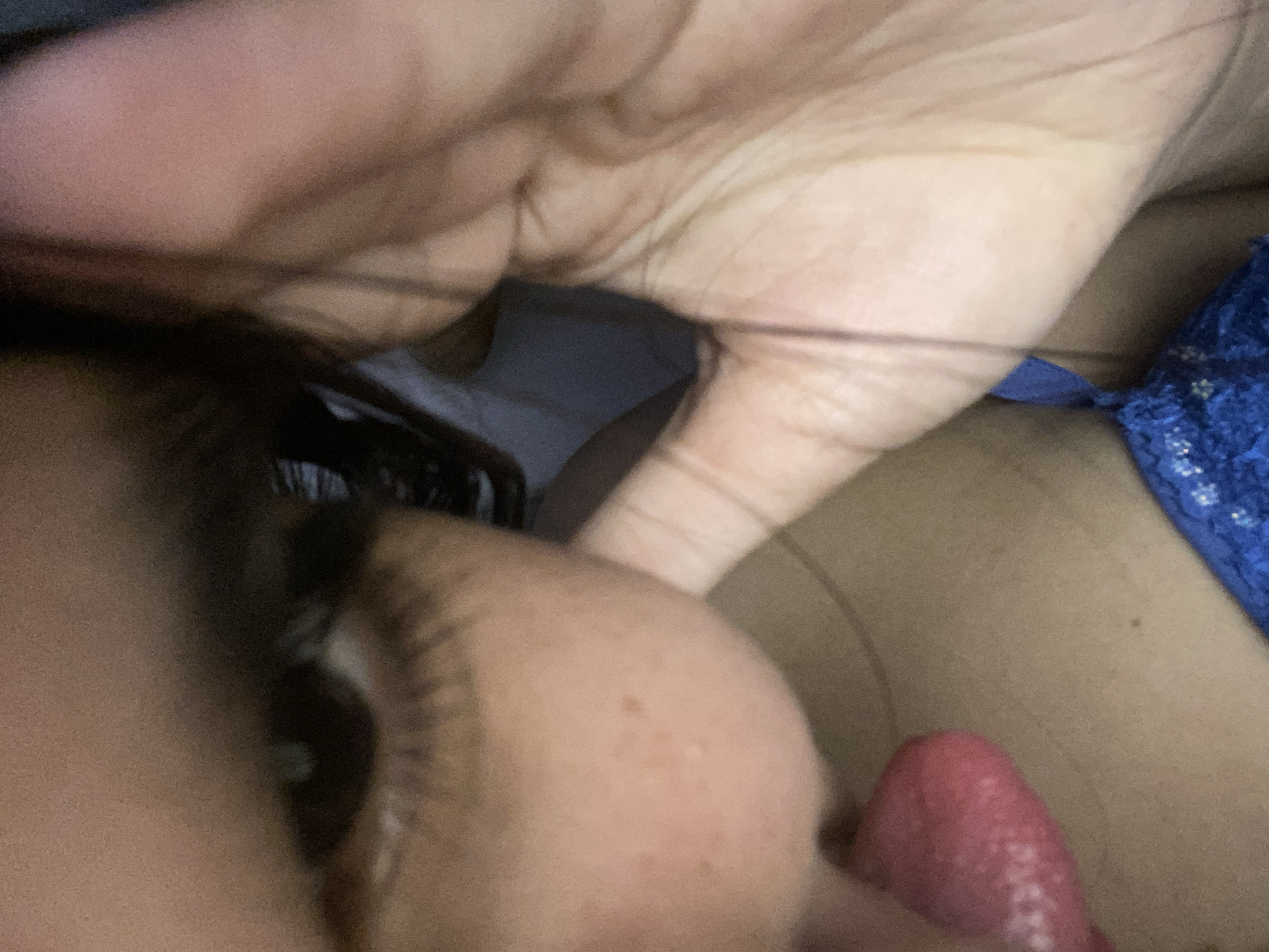 A close-up image shows a person's face with their eye visible in the left side of the frame. The person's hand and the tip of their tongue are also visible. A blue lace garment is present in the background. There is no indication of a location in Cotoperíz, Venezuela, or any discernible environmental details.