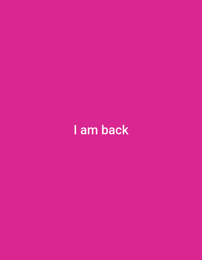 A plain, bright pink background occupies the entire image. Centered horizontally and positioned in the lower half of the frame are the words "I am back" rendered in white, sans-serif capital letters. The image is not geographically located in Jos, Nigeria.