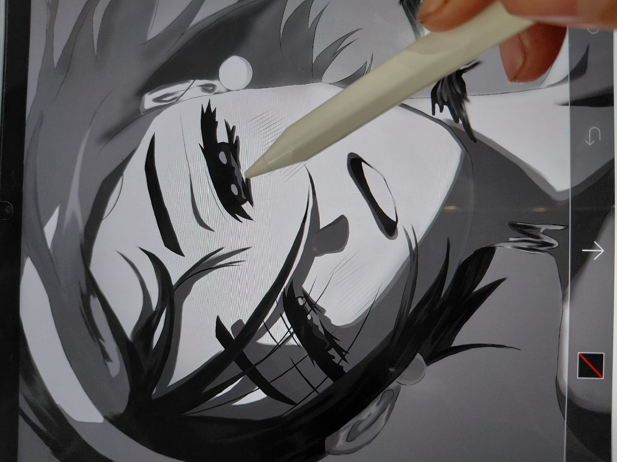 A close-up, grayscale image shows a digital illustration of a stylized face, likely an anime or manga-inspired character, in progress on a tablet. The face is turned slightly to the side, with details like eyes, hair, and facial contours drawn in black and white. An Apple Pencil hovers near the character's left eye, indicating that the artist is actively working on the image. The tablet's interface is visible, with arrows and a selection tool icon visible on the screen's right edge. The image does not depict the city of Nadym, Russia, or any real-world location; it solely focuses on the digital artwork and the artistic process.