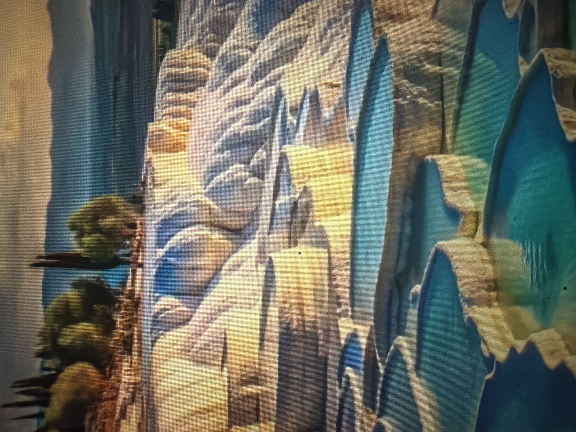 The media file depicts a surreal, otherworldly landscape with striking geological formations. The primary subjects are towering, jagged rock structures, some appearing crystalline and glowing with vibrant teal and blue hues, while others are textured with earthy, sandy tones. Interspersed among these formations are hints of lush green foliage, suggesting a vibrant, living element within this fantastical environment.
The scene is bathed in a warm, golden light, reminiscent of a sunset or sunrise, casting long shadows and highlighting the intricate textures of the rocks. The atmosphere feels serene and awe-inspiring, with a sense of wonder evoked by the unusual combination of sharp, mineral-like shapes and organic greenery.
While there are no visible people or specific objects in the traditional sense, the landscape itself acts as the central focus. The scale and grandeur of the formations suggest a vast, possibly alien, world. The detail in the textures of the rock—showing striations, layering, and rough surfaces—adds a sense of realism to the otherwise fantastical setting. The presence of what appear to be trees on the left side, though somewhat abstract and stylized, provides a scale reference and hints at a possible connection to nature. The overall impression is that of a breathtaking natural wonder, perhaps a landscape from a fantasy film or video game, rendered with a strong emphasis on light and texture. There is no visible text in the image.