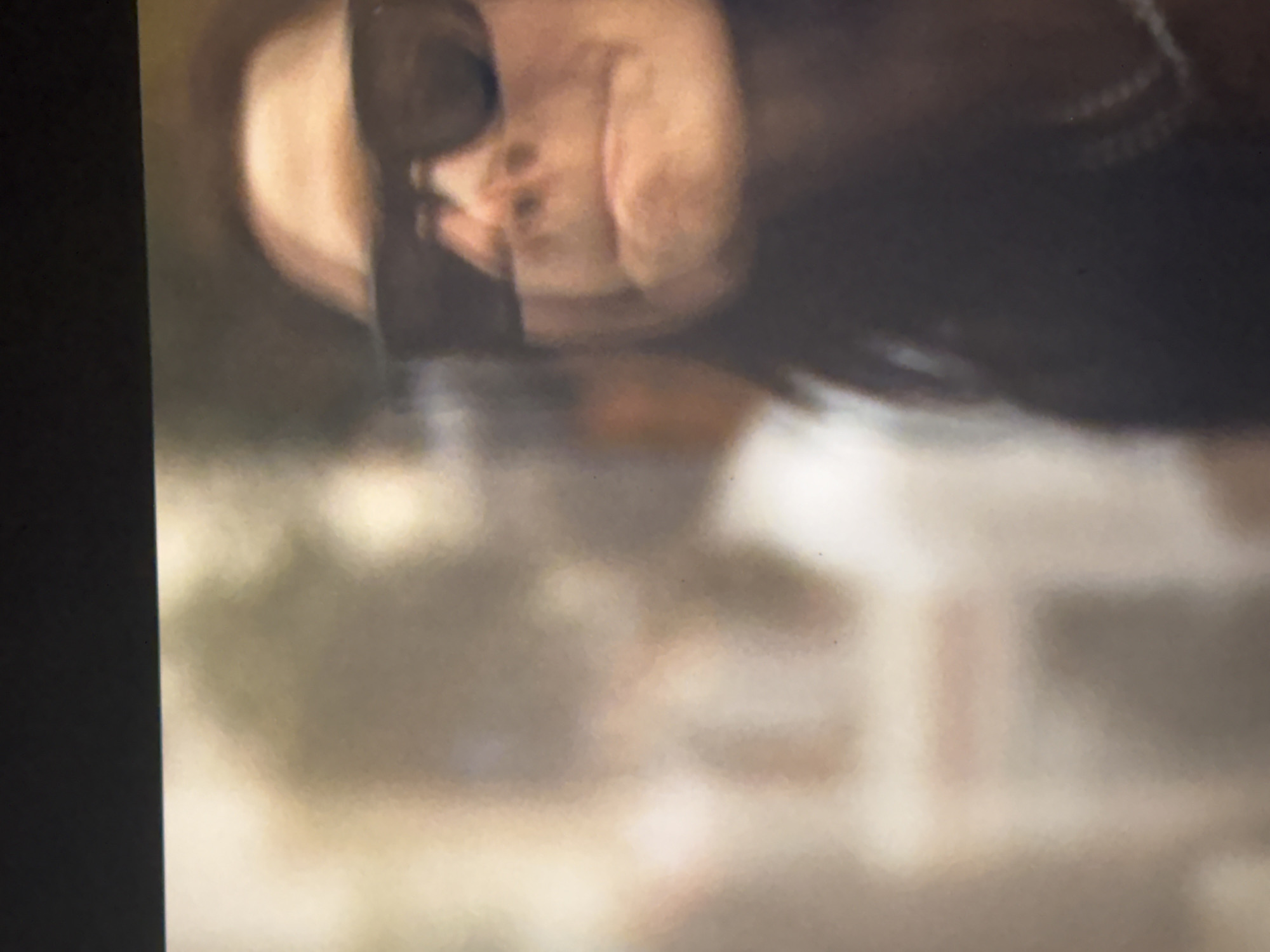 The image depicts a blurred and rotated view of a person wearing sunglasses. The person's face is visible, though indistinct due to the blur. The environment is unclear, but it seems to be a public space, given the indistinct elements of the scene. Determining the exact location in Mexico City from this image alone is not possible due to the low resolution and blurriness.