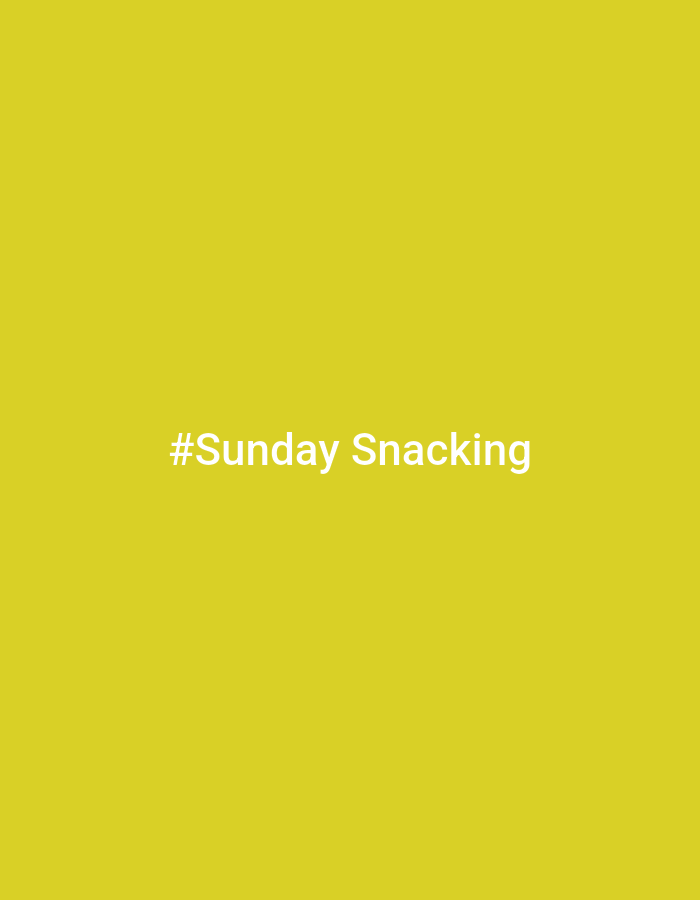 The image is a plain, solid yellow background with white text in the center that reads "#Sunday Snacking". There are no other objects, people, or discernible environmental features present in the image, and therefore no information can be extracted about the city of Chaikovsky, Russia, or any other location.