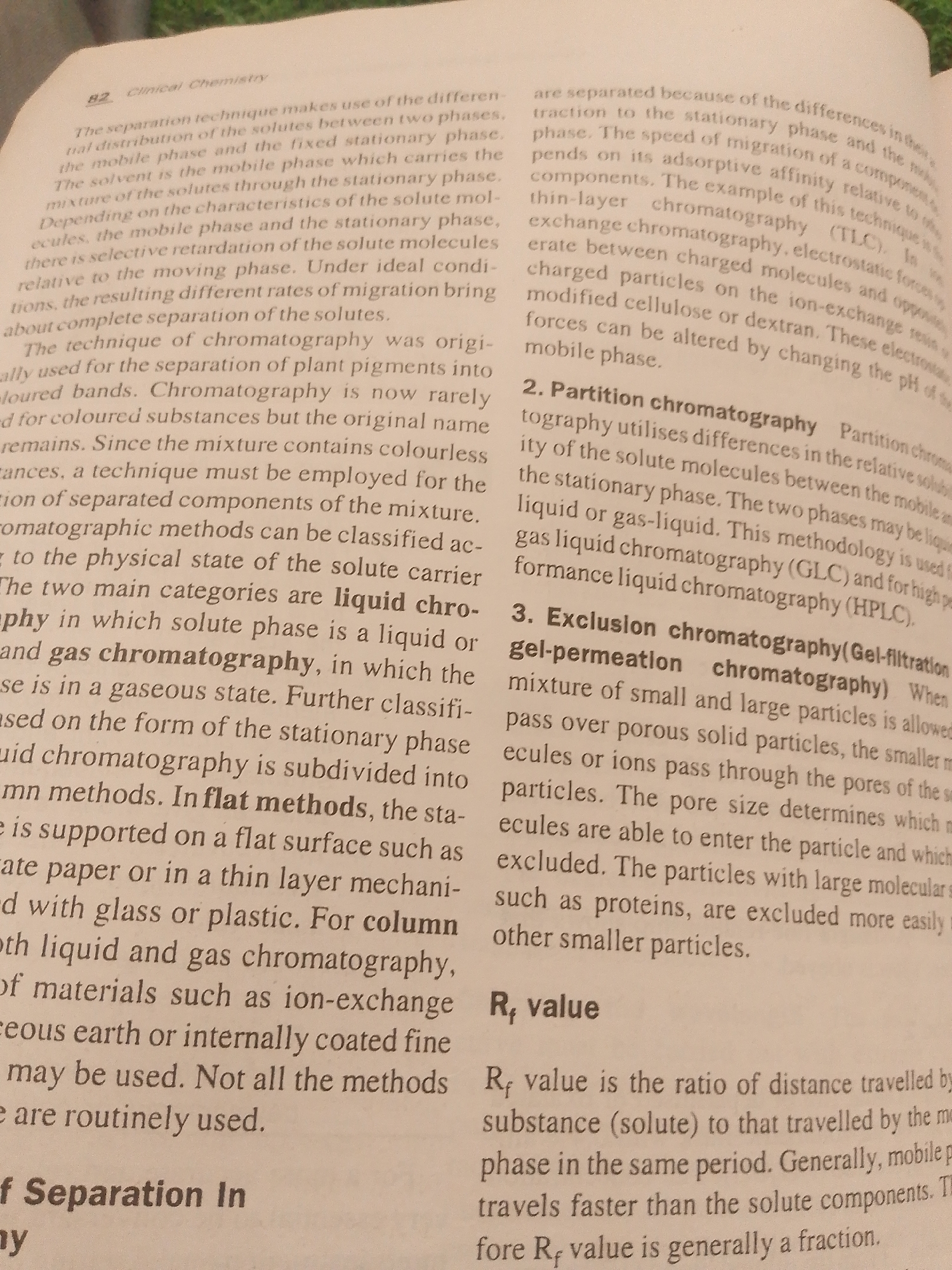 The image shows a page from a book on "Clinical Chemistry." The text discusses chromatography, a separation technique. Specifically, it covers different types of chromatography, including thin-layer chromatography, partition chromatography, and exclusion chromatography. It also defines R_f value as the ratio of the distance traveled by a substance to the distance traveled by the mobile phase. The text is in English. The image does not contain any information about the city of Jauro Yinu, Nigeria.