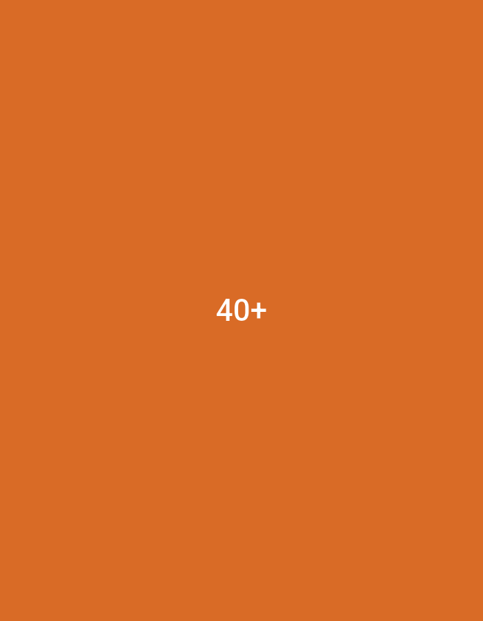 The image is a plain, orange background with the text "40+" in white, centered in the middle of the frame. There are no people, subjects, objects, or actions visible. The environment is not specified and there is no indication of its location in Lensedly, Czechia.