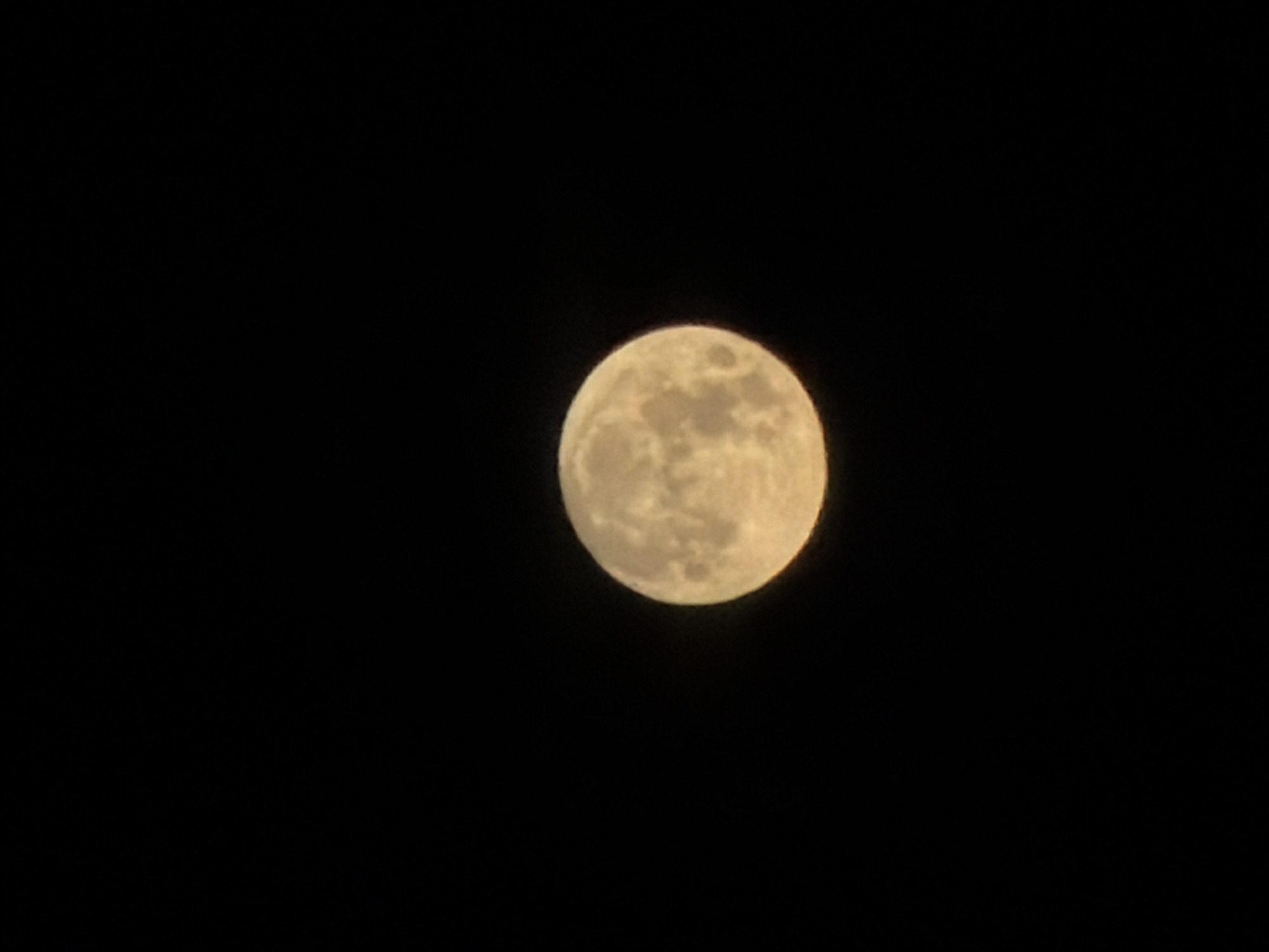 The image shows a full moon in the night sky. The moon is centered in the frame and appears bright against the black background. No location can be determined, and there are no people, subjects, objects, actions, or interactions in the image other than the moon itself. The image does not provide any information related to the city of Atlanta.