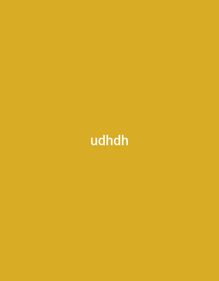 The media file is a simple graphic featuring a solid golden yellow background. Centered horizontally and vertically on this background is the text "udhdh" rendered in white, sans-serif letters. There are no other subjects, objects, or activities depicted in the image. The plain nature of the graphic offers no visual cues regarding time of day, weather, or specific geographical location. While the provided context indicates Yerevan, Armenia, the image itself contains no visual elements to confirm or suggest this location.
