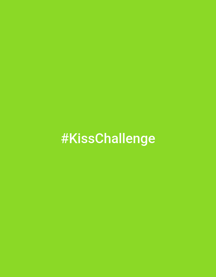 The image displays a digital graphic featuring a solid, vibrant lime green background. Centered horizontally and slightly below the vertical midline is the white text "#KissChallenge" in a sans-serif font. The image contains no discernible people, physical objects, actions, interactions, or environmental elements that would indicate a specific physical location, including any area within the city of Moscow, Russia. The scene is entirely graphic, devoid of real-world context.