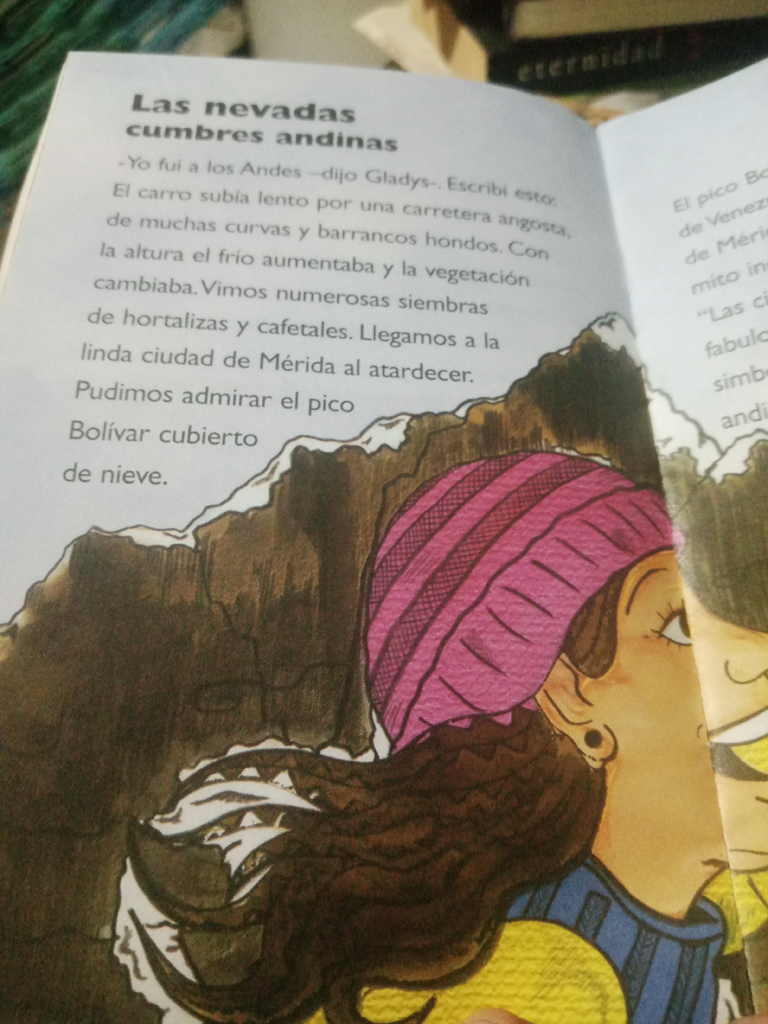 The image displays an open book with Spanish text and an illustration. The text on the left page is titled "Las nevadas cumbres andinas" and describes a journey to the Andes, mentioning a car ride up a road with curves and steep drops, observing vegetation, crops, and coffee plantations, and arriving at the city of Mérida at sunset. It also mentions admiring Pico Bolívar covered in snow. The illustration on the right depicts a close-up of a person's face, wearing a pink knitted hat and a blue and yellow striped garment. Their profile is visible, with dark hair and dark eyes looking to the right. A portion of another person's face is visible to the far right. The background of the illustration shows a mountainous landscape with snow-capped peaks, rendered in muted brown and white tones. The book's pages are slightly yellowed, indicating age. There is no information about Santa Ana, Venezuela, in the provided text or imagery.