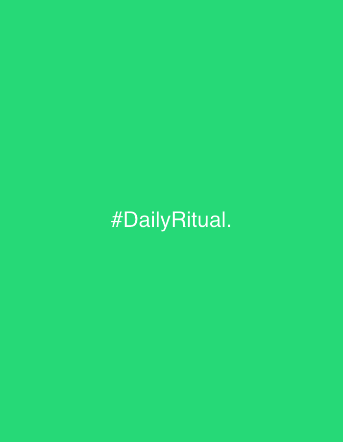 The image displays a minimalist design featuring a solid, vibrant green background. No people or specific objects are discernible within the frame. There is no activity or event taking place; the image is static.
The most notable detail is the text centered on the green backdrop. The visible text reads "#DailyRitual." It is rendered in a clean, sans-serif font, appearing in a light color, likely white or light gray, contrasting clearly with the green. There are no additional visual cues regarding the time of day, weather, or a specific physical location.