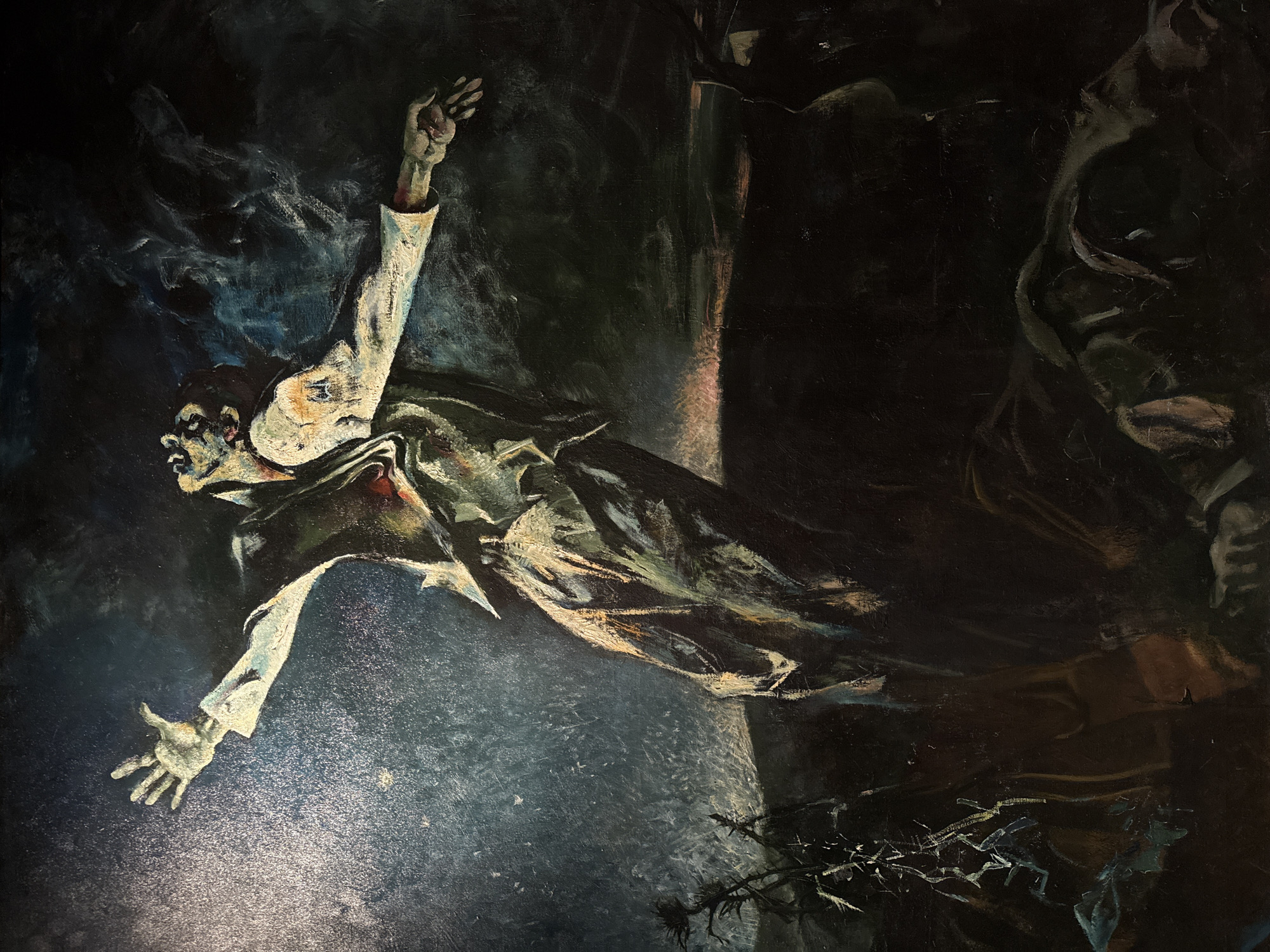 The image is an oil painting depicting a man in mid-air against a dark and ambiguous background. He is wearing a white shirt with sleeves rolled up, and a dark jacket or coat. His left arm is outstretched, fingers spread, while his right arm is raised upwards. His face is pale and appears contorted.
The background is predominantly dark, with indistinct shapes and shadows. In the lower right corner, there are thorny branches. A vertical line bisects the center of the image.
There is no direct evidence to conclude anything about a specific location in Moscow, Russia. The scene is abstract and lacks any clear landmarks or contextual cues that would tie it to a specific place.