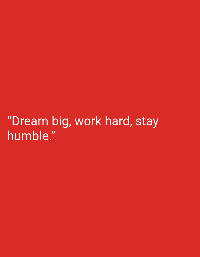 The image displays a solid red background with white text. The text reads, "Dream big, work hard, stay humble." There are no people, objects, or environmental details present in the image. The location of Suka Ramai, Indonesia, is not depicted or referenced in the image.