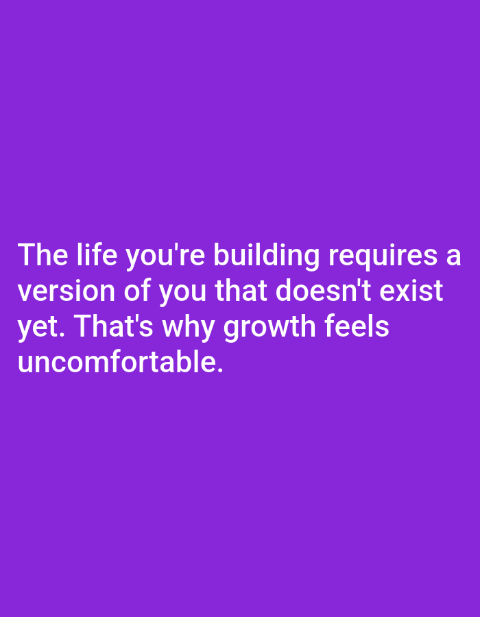 The image is a close-up, straight-on shot of text on a solid purple background. The text, which is white, reads: "The life you're building requires a version of you that doesn't exist yet. That's why growth feels uncomfortable." There are no people, objects, or environmental details visible in the image. The location in Алмалыбақ, Kazakhstan, is not depicted or referenced in the visual content.
