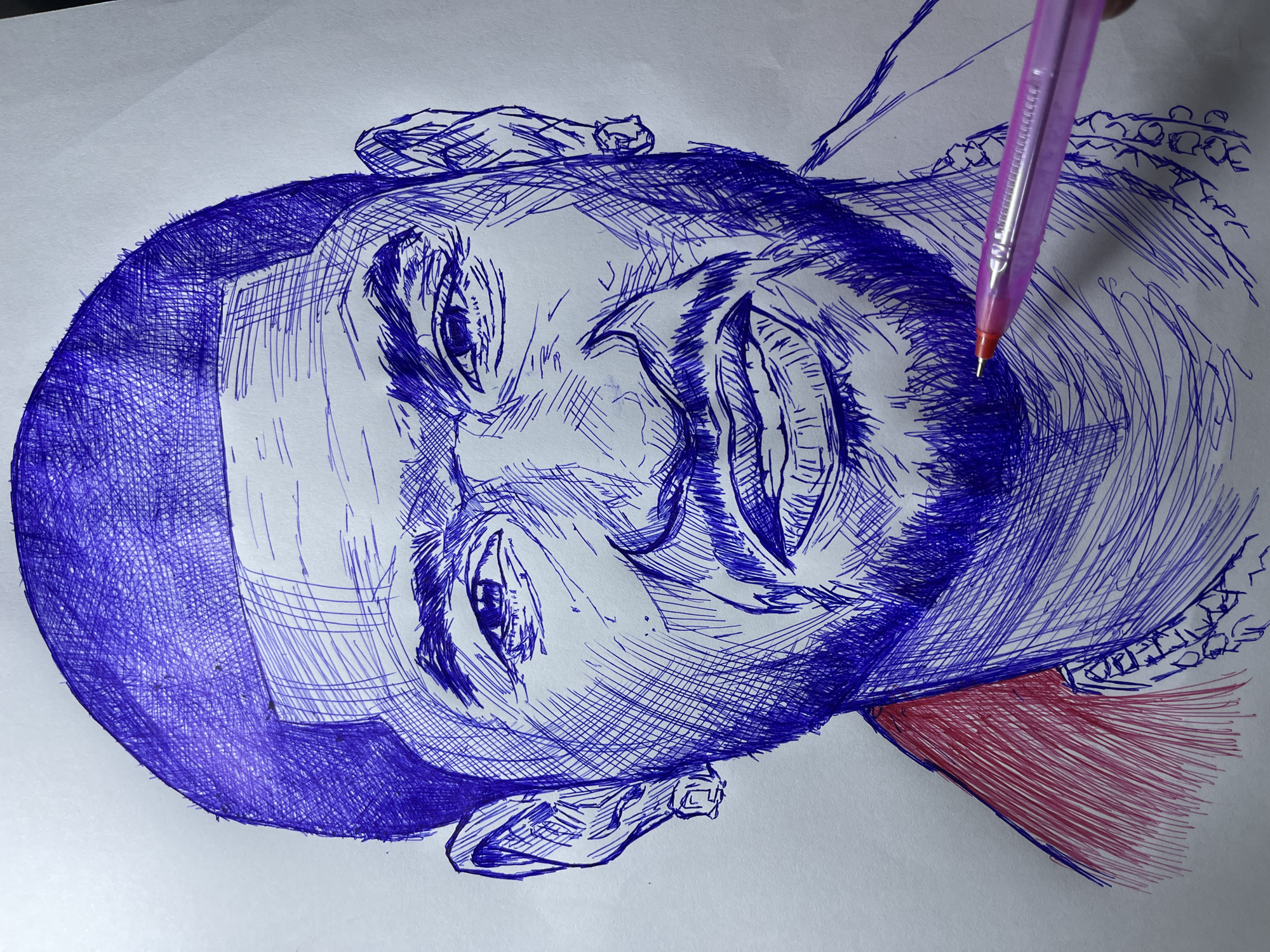 A close-up, detailed pen-and-ink sketch depicts the face of a Black man, rendered with blue ink and some red for his clothing. The portrait is characterized by strong hatching and cross-hatching techniques, creating texture and depth. The man has short hair, a prominent beard, and is wearing earrings. His expression is intense, with furrowed brows and a slight grimace. A pink pen is visible in the lower right corner, touching the drawing, suggesting it is in progress. The background is a plain white surface. The sketch is an artistic representation and does not depict any specific location in Jos, Nigeria, or any discernible environment.