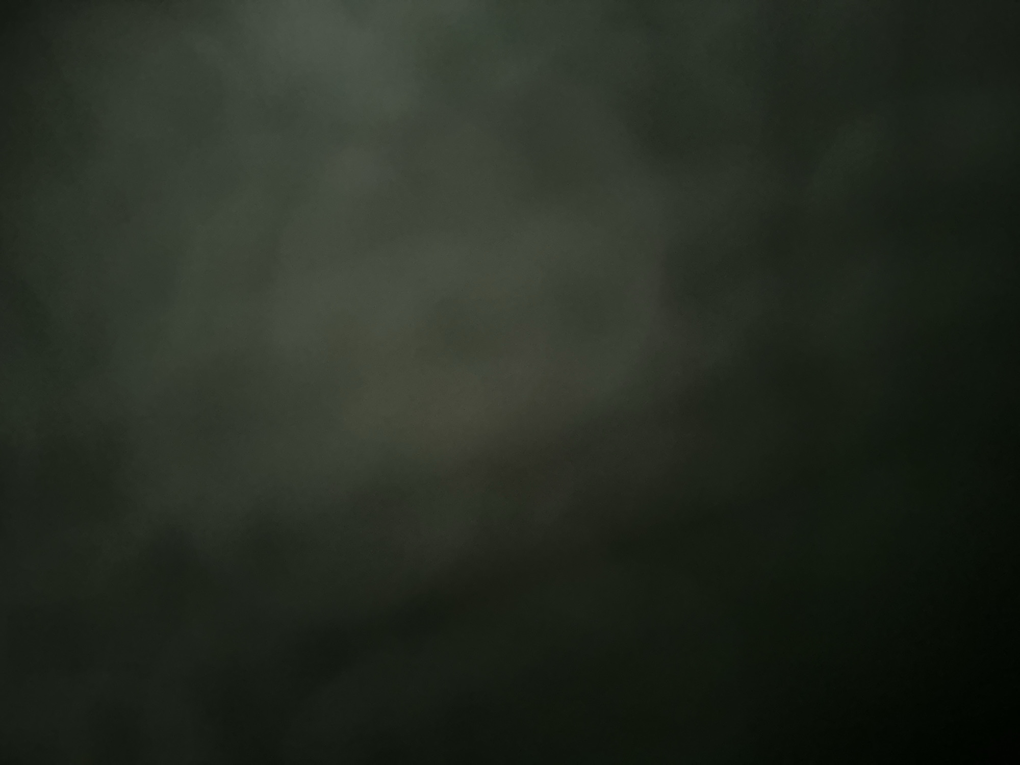 This is a dark, abstract image with no discernible subjects, objects, or scene. The lighting is very low, creating a murky and indistinct atmosphere. There are some lighter, cloud-like shapes present, but they are too blurred to identify any specific forms. The overall impression is one of darkness and obscurity, with a hint of texture. No text is visible. The crops provided offer slight variations in the distribution of these indistinct shapes but do not reveal any clearer details.
