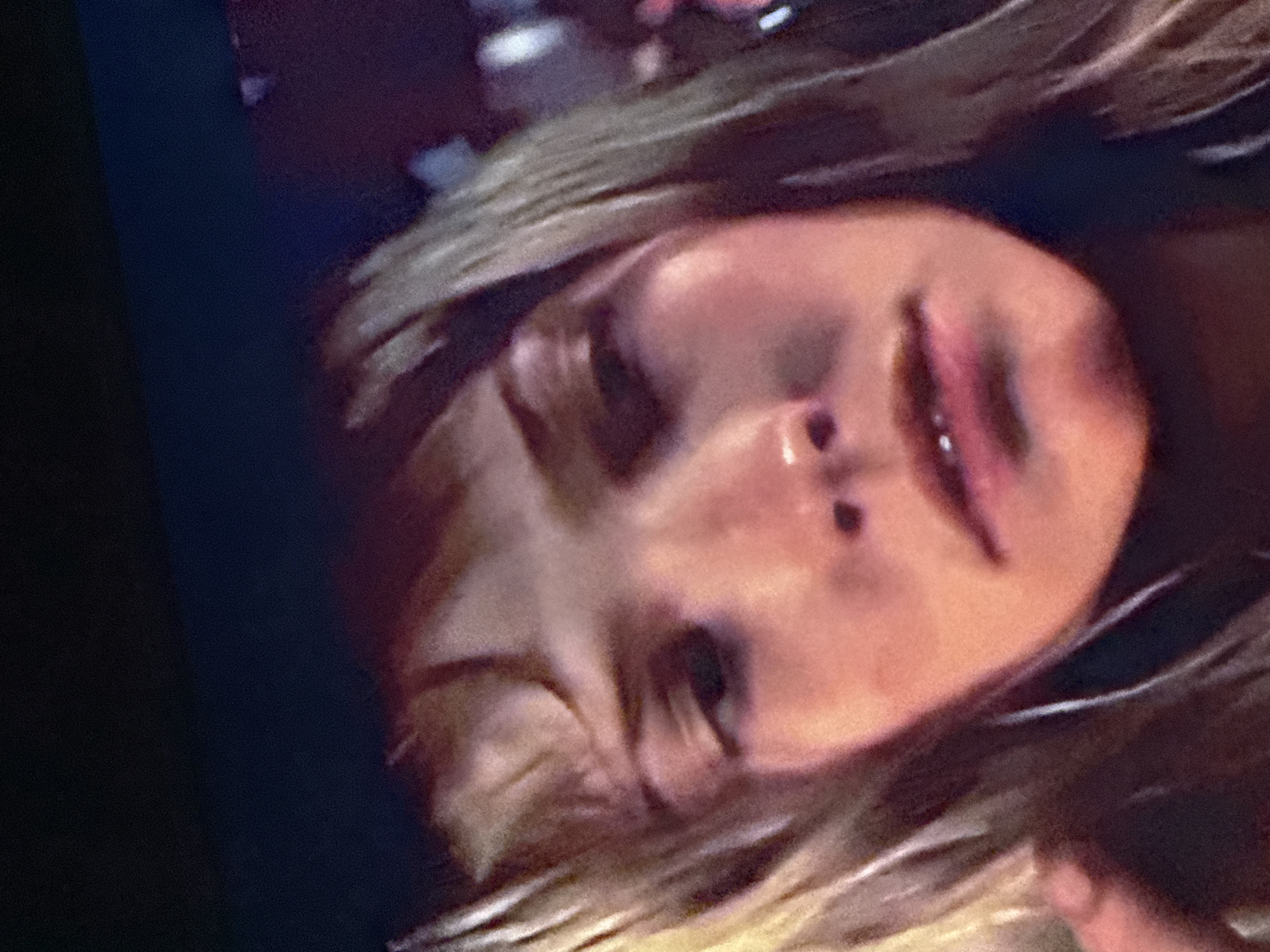 The image is a close-up of a person's face, tilted to the side. The person has light-colored hair and appears to be wearing lip gloss. Due to the limited context, it is not possible to determine a specific location in Mytishchi, Russia.