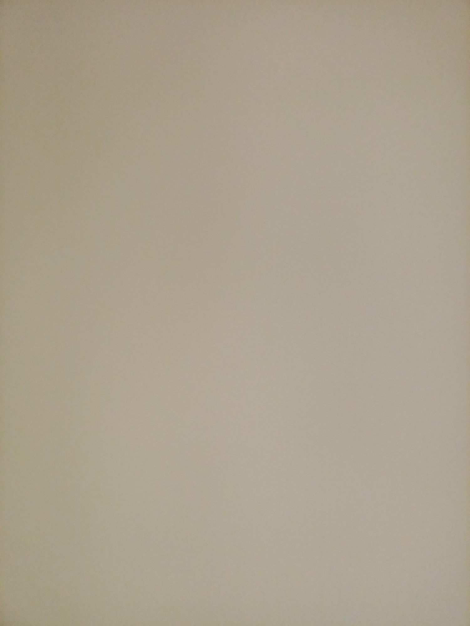 The image is a plain, neutral background, likely a wall or a piece of paper. The color is a light beige or tan with a slightly textured appearance. There are no discernable objects, people, or any features that would indicate a specific location in Rostov-on-Don, Russia, or any other city. The lighting appears even, with no strong shadows or highlights.